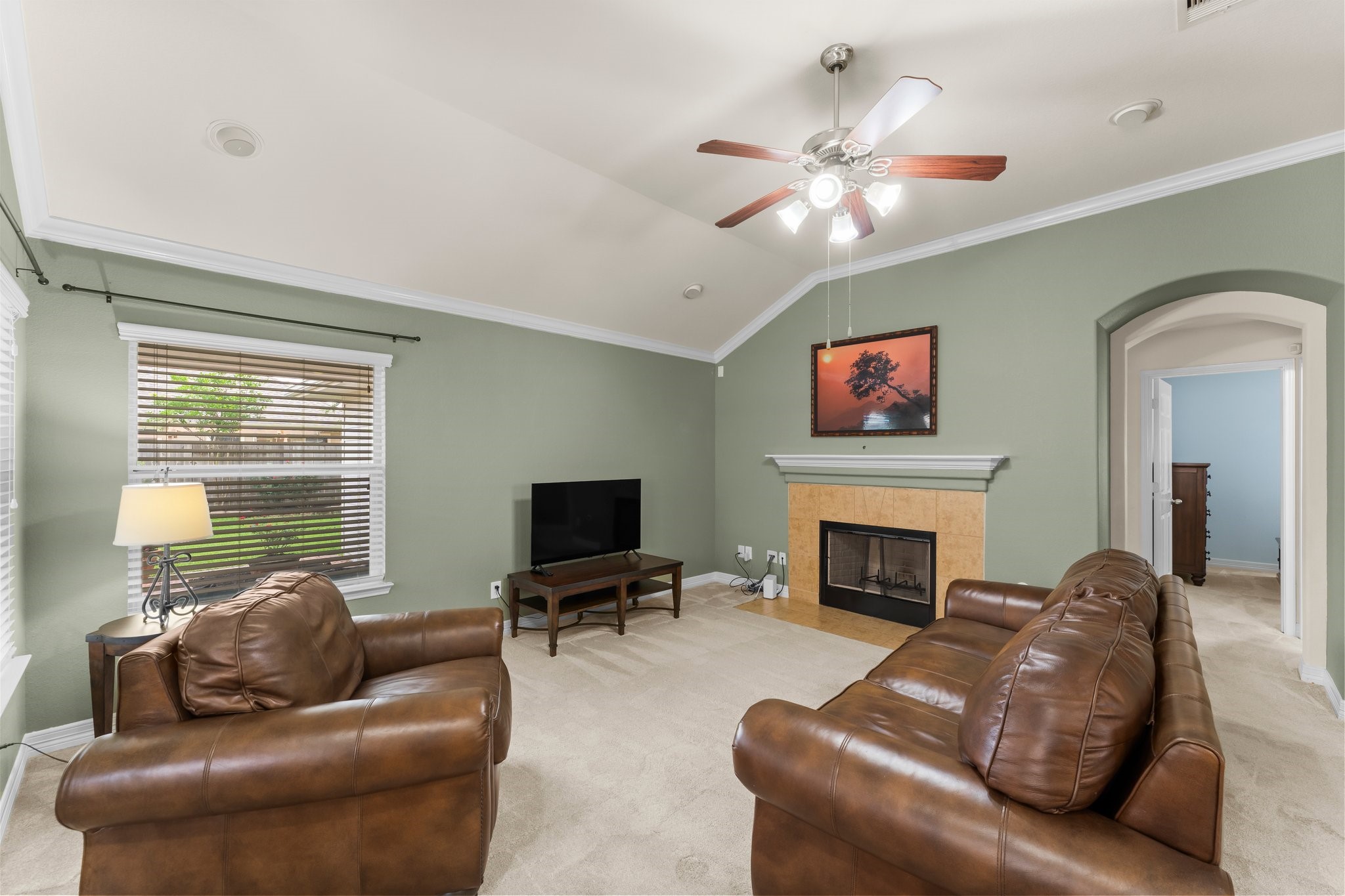 The cozy fireplace is the perfect focal point of the family room.