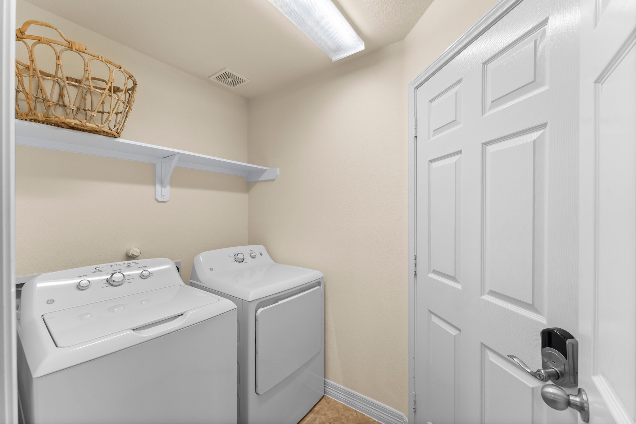 Efficient laundry room washer and dryer included.