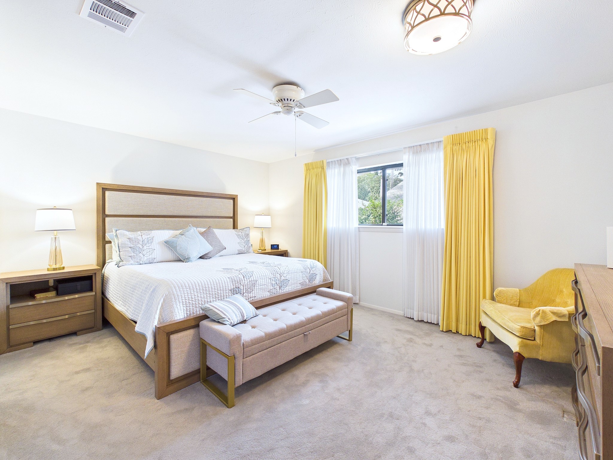 Light and bright, this cozy primary retreat natural light, open space and room to retreat. A king sized bed fits easily.