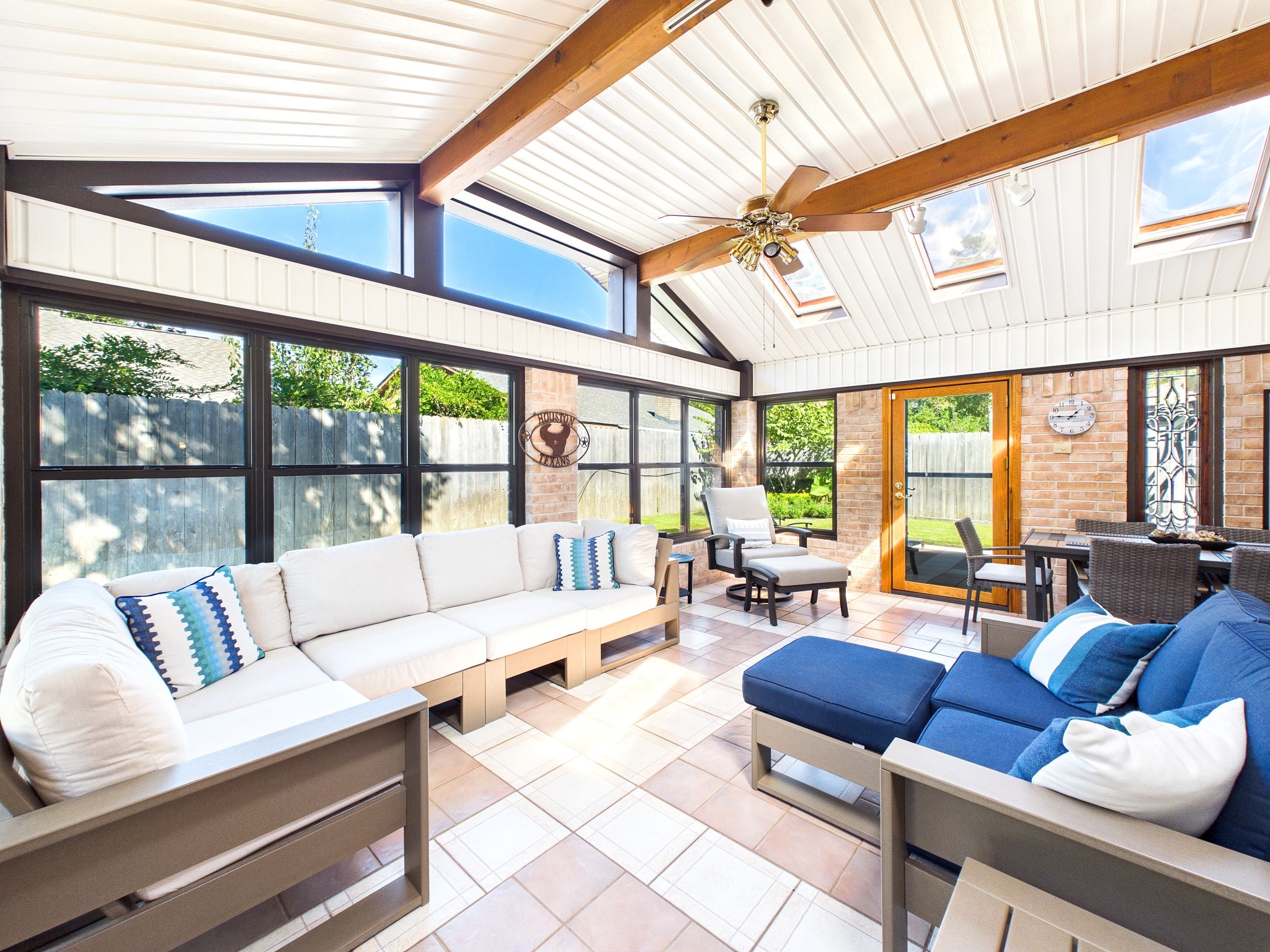 Experience year-round comfort in this stunning sunroom featuring ample extra square footage, complete with AC and heat for ultimate relaxation.