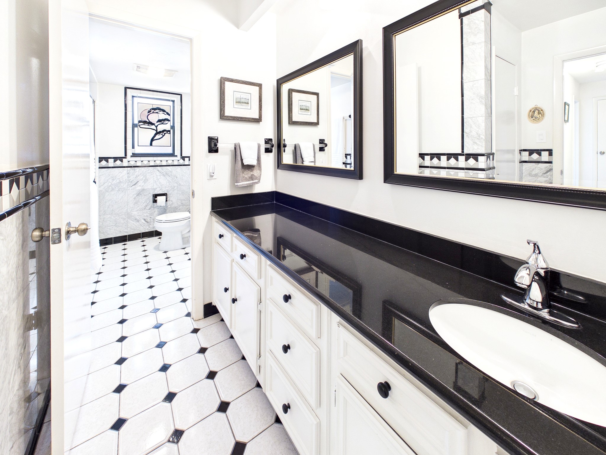 Experience the luxury of a shared bath with distinct separate rooms, combining privacy and elegance in a beautifully designed space.