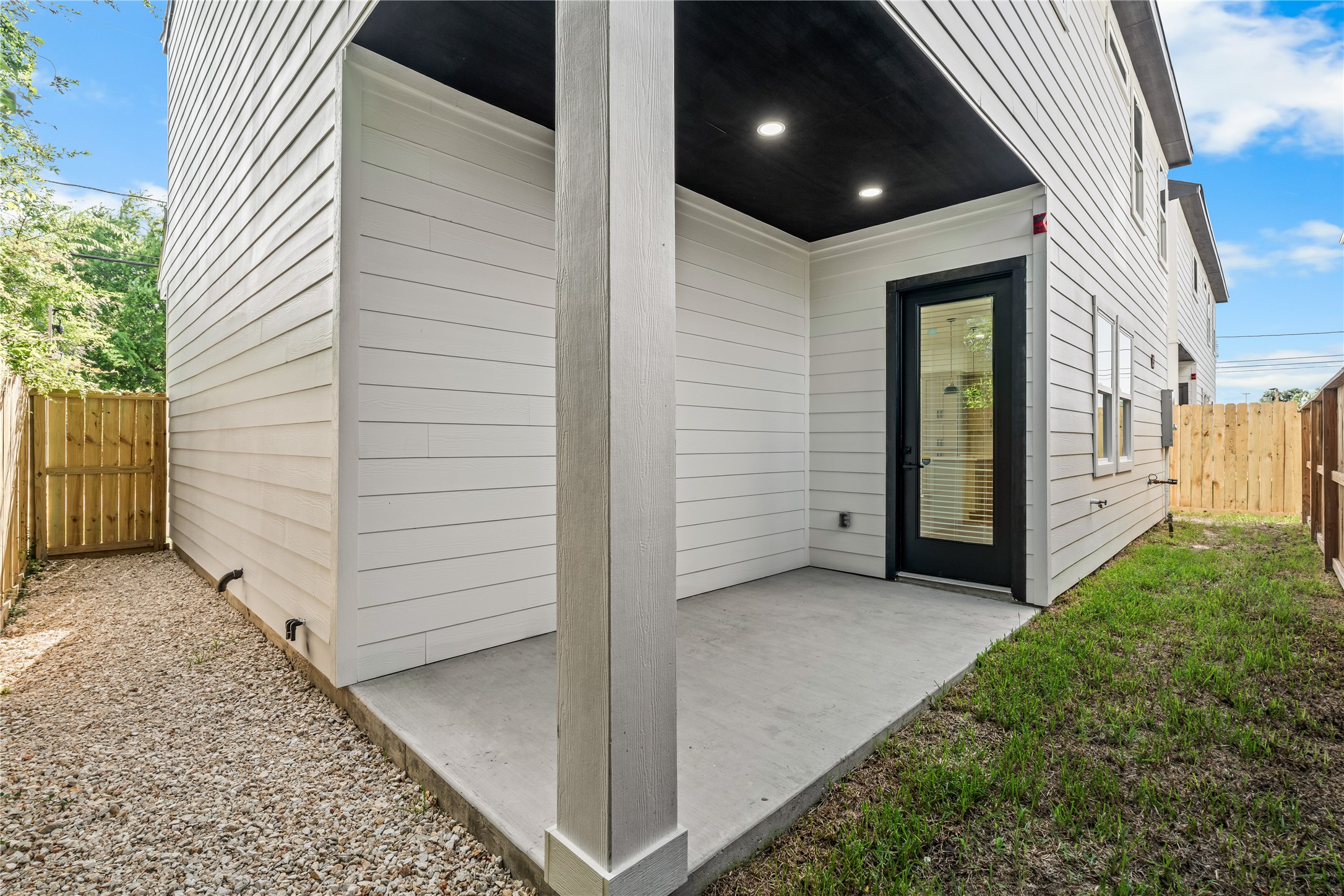 Low-maintenance luxury. The fenced-in yard offers the ideal blend of green grass and clean gravel pathways, giving you a secure pet-friendly space without endless weekend yard work.