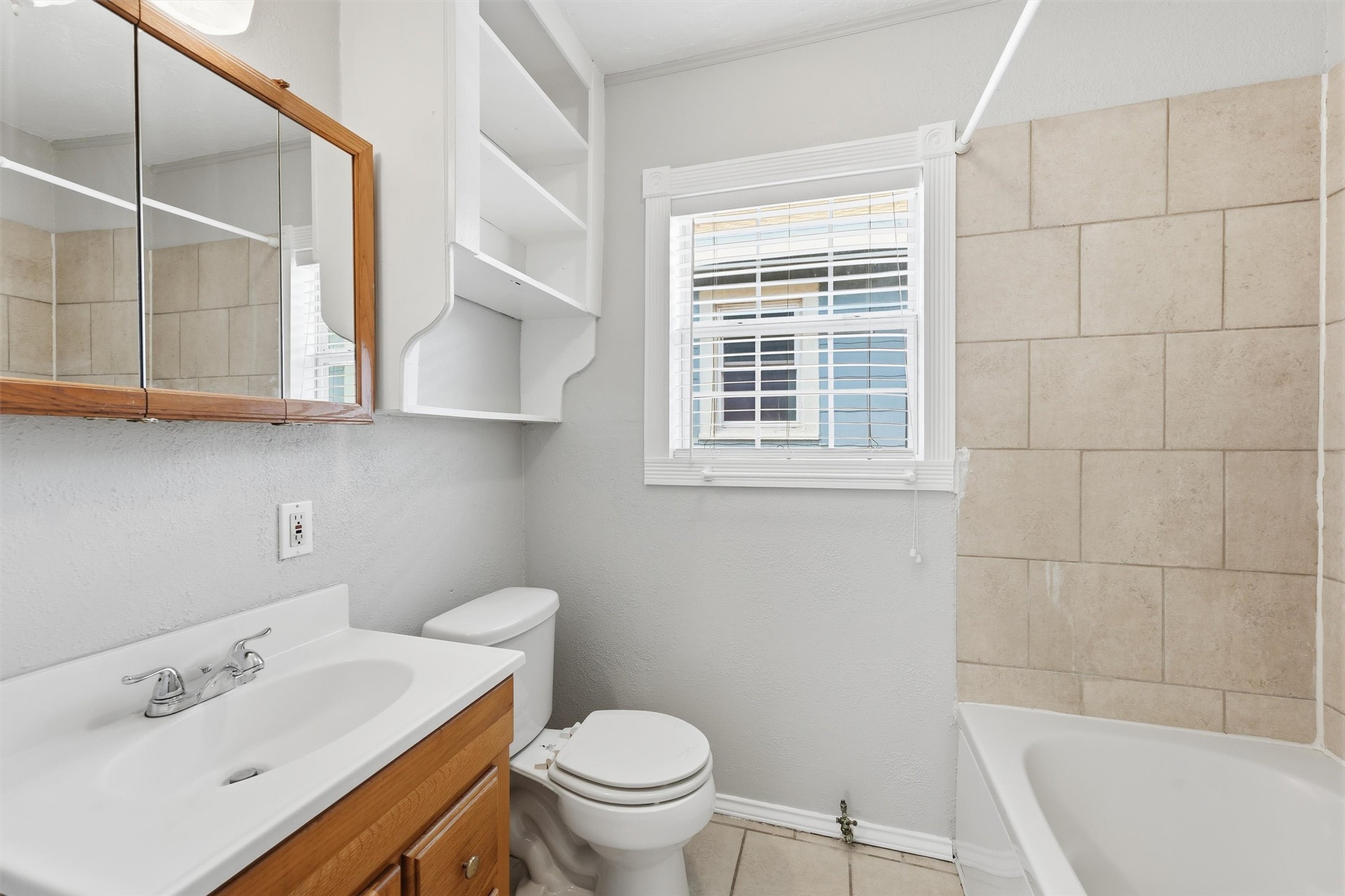 Bathroom with jetted tub/shower combo.