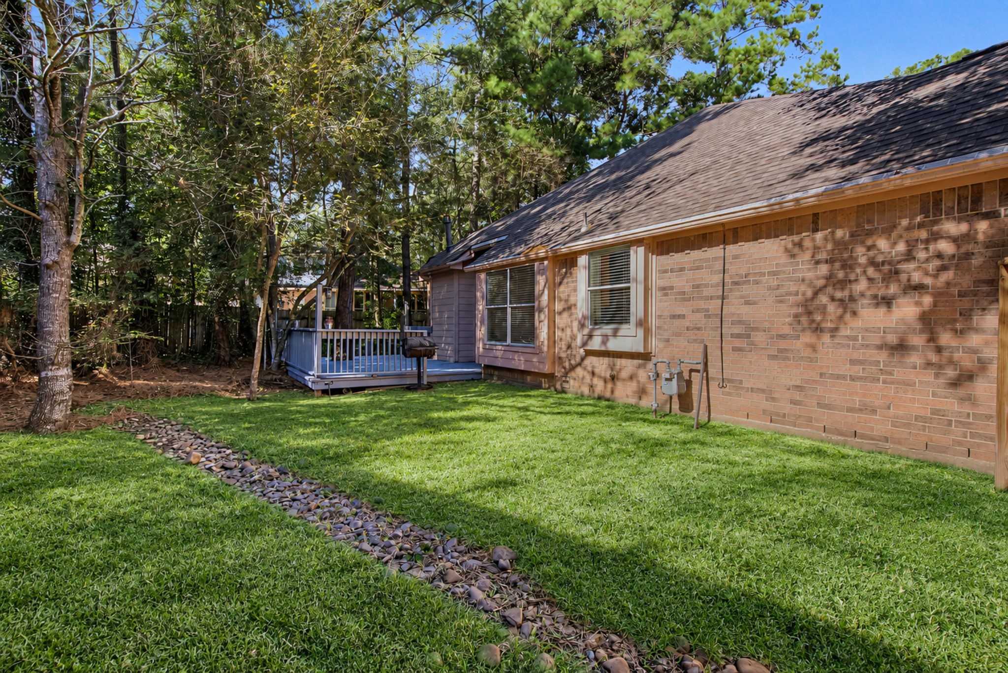 Reimagined sideyard with new sod installed.