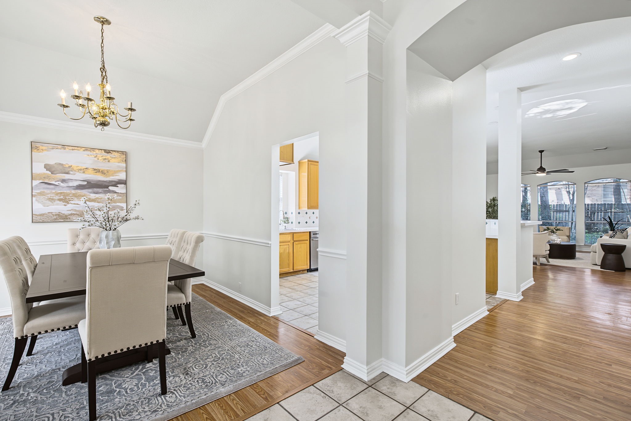 Arched openings connect the entry, dining room, and main living areas, creating an easy flow through the home.