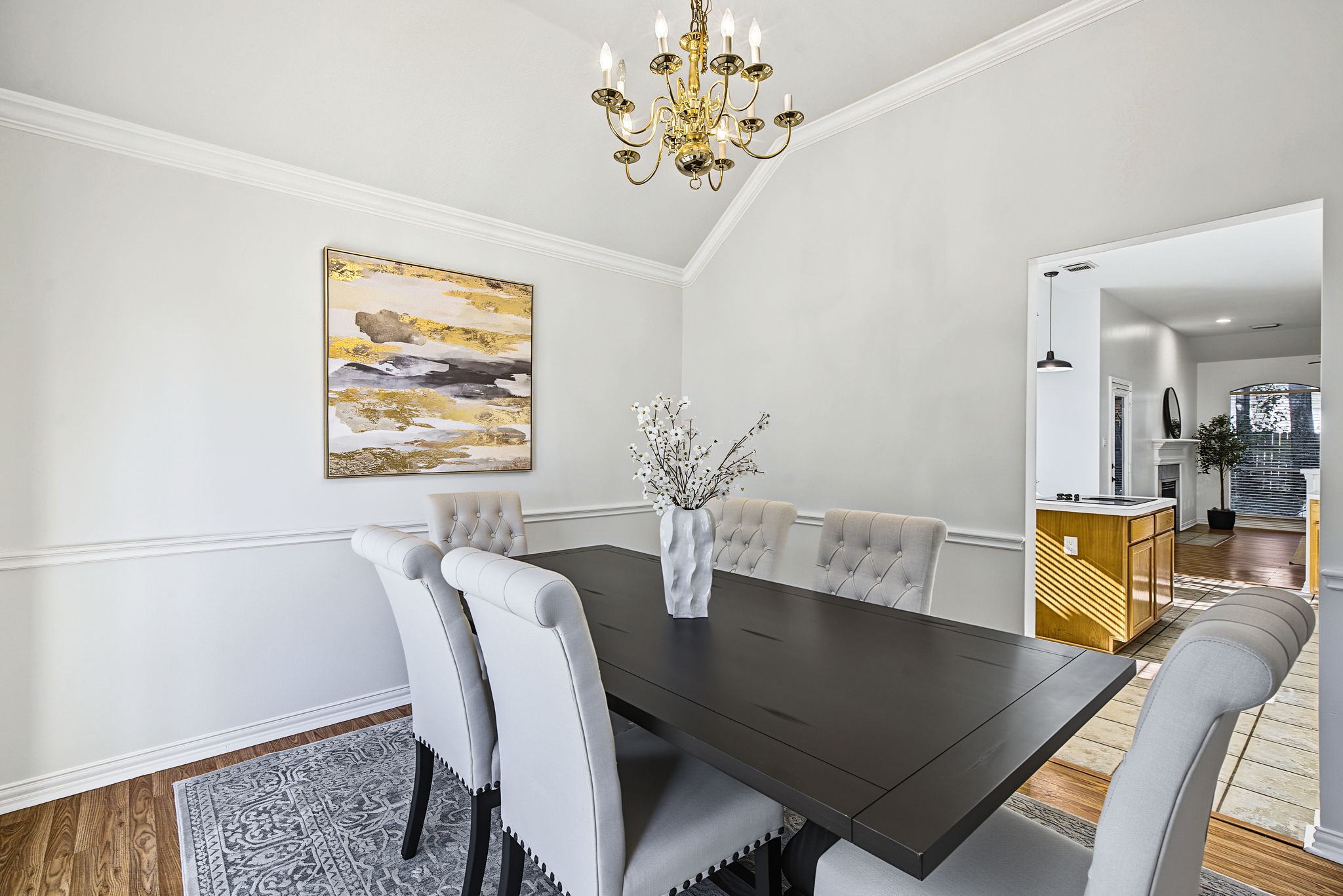 The dining room connects conveniently to the kitchen, keeping meal service simple while providing a dedicated space to gather.