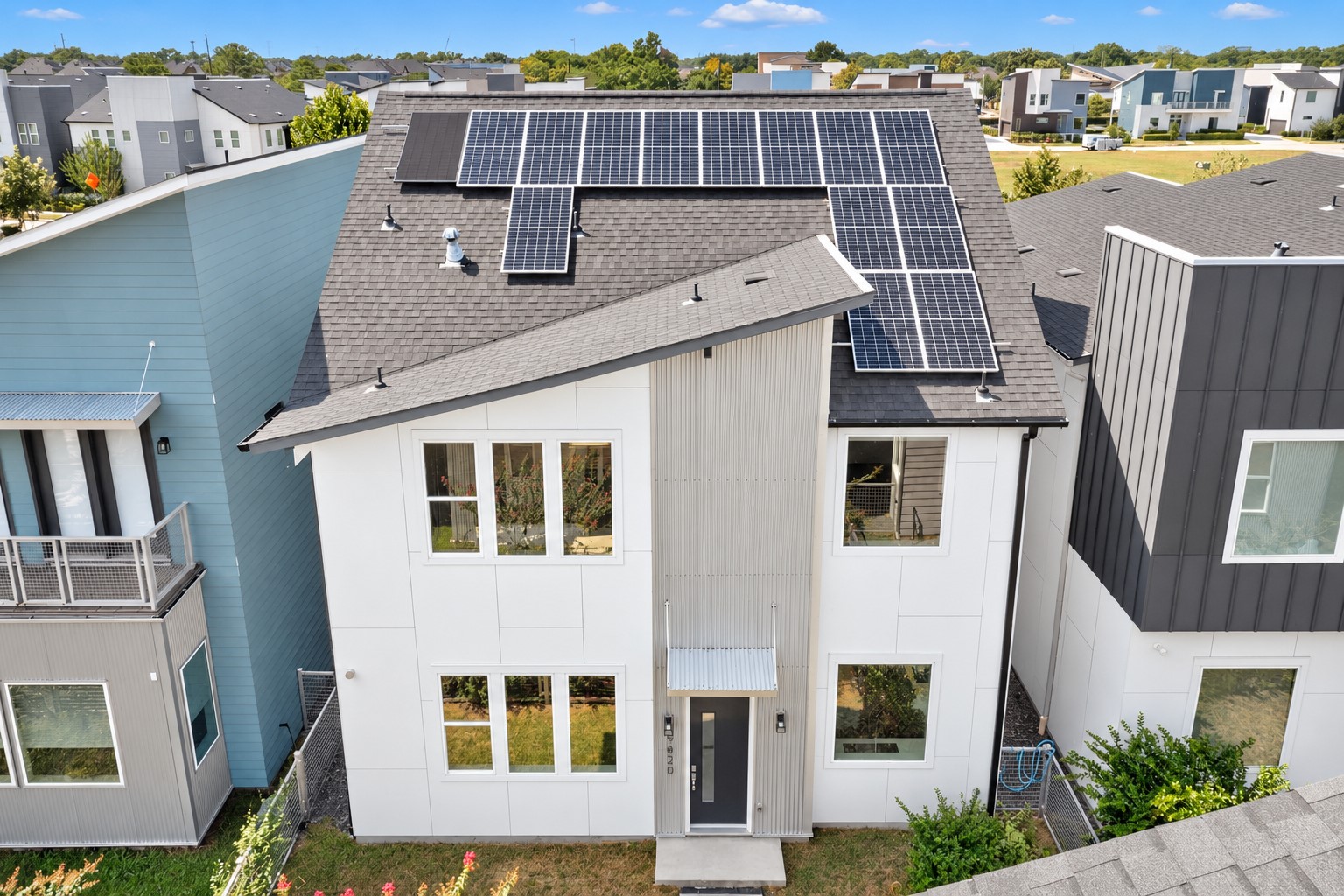 9820 Mocking Bird Hill ln is a Modern day two-story home featuring an energy-efficient solar backup system with, sleek siding, and large windows for abundant natural light.
