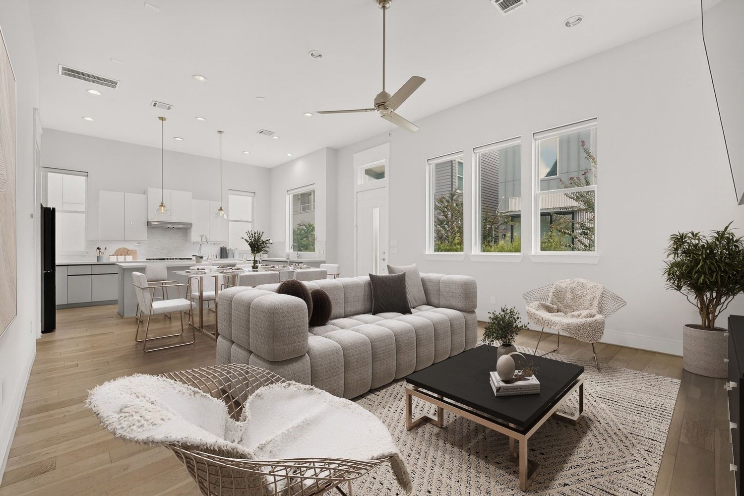 Discover a spacious open-concept living area with abundant natural light, featuring modern finishes and a seamless flow from the stylish kitchen to the cozy lounge space.