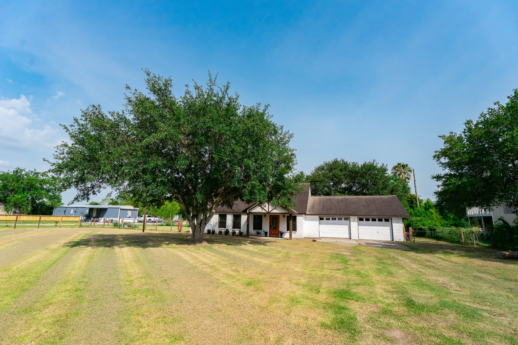 View from the street... what a great front yard.  Baseball, anyone?  Perhaps a bit of golf?