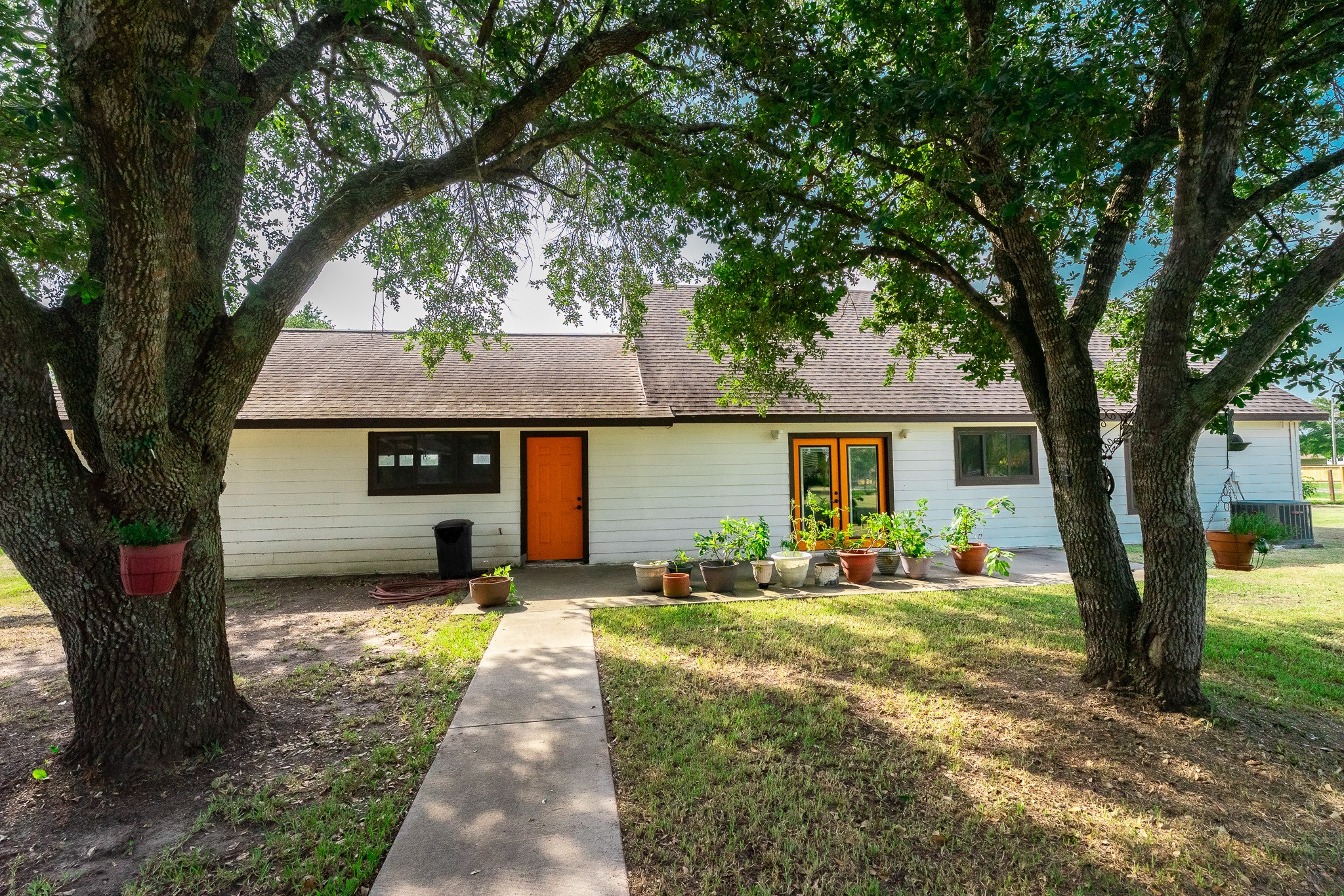 Mature trees provide shade for your backyard activities.
