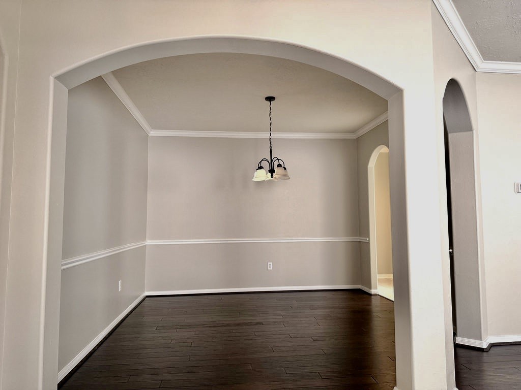 Formal dining room has room for a large table and chairs
