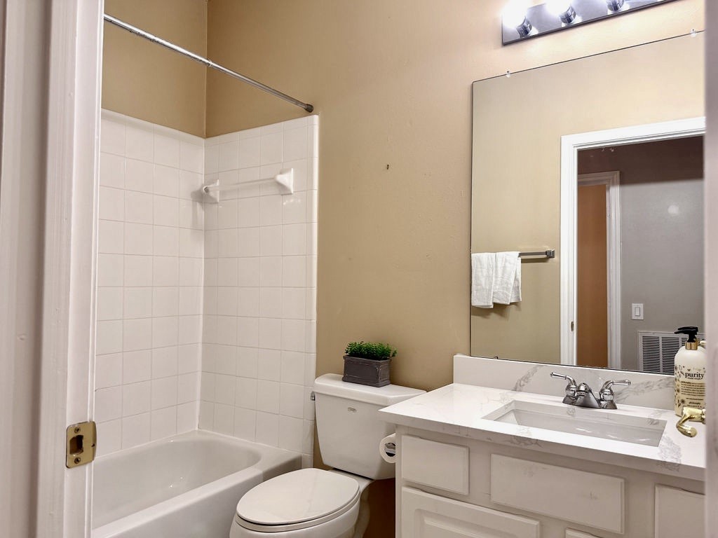 Secondary bath with shower tub combination with granite counter