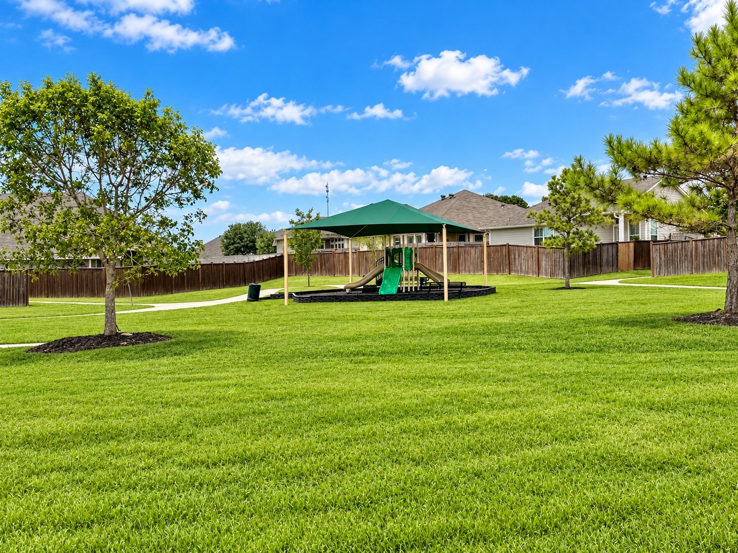 Another view of the same park but this one showcases the abundant play space & walking paths included!