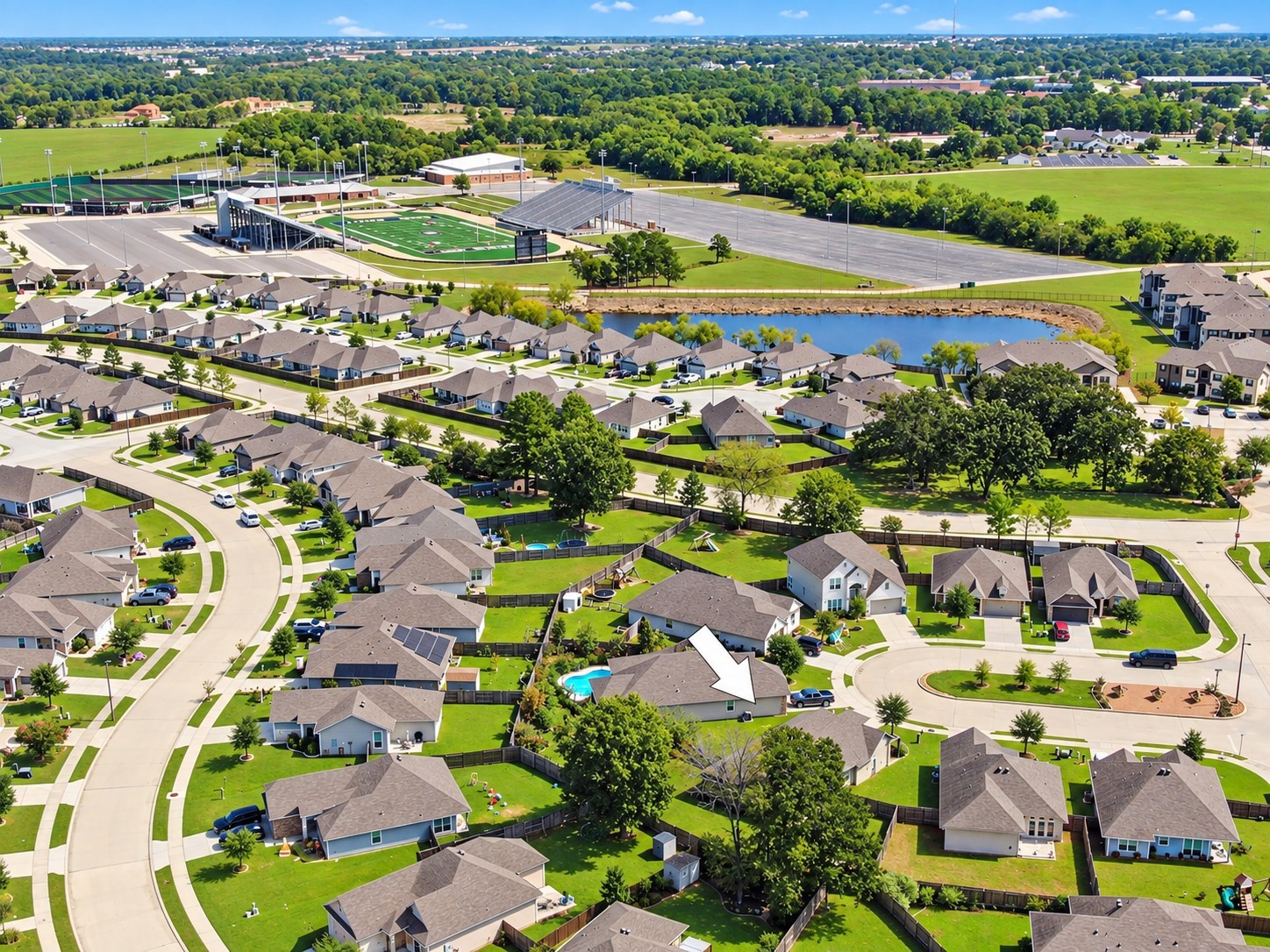This home is less than one mile from the Montgomery ISD Athletic Complex, which includes football, baseball, softball and the Aquatics Center and you can see the proximity in this photo!