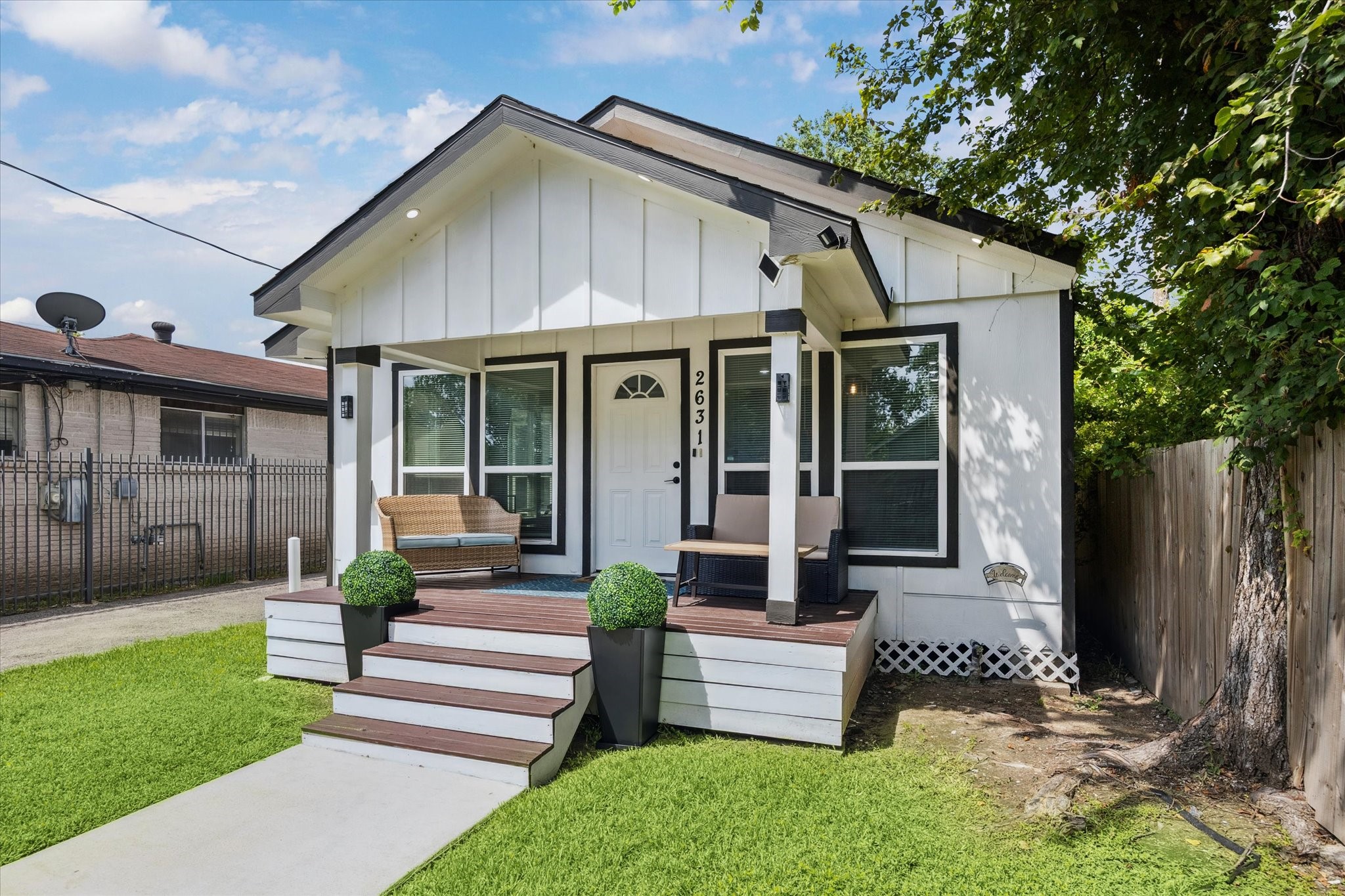 Freshly painted and full of charm, this modern bungalow features a classic black-and-white exterior and a cozy covered front porchperfect for morning coffee or winding down in the evening. Clean lines and updated finishes give it a crisp, stylish look from the moment you walk up. Freshly painted and full of charm, this modern bungalow features a classic black-and-white exterior and a cozy covered front porchperfect for morning coffee or winding down in the evening. Clean lines and updated finishes give it a crisp, stylish look from the moment you walk up.