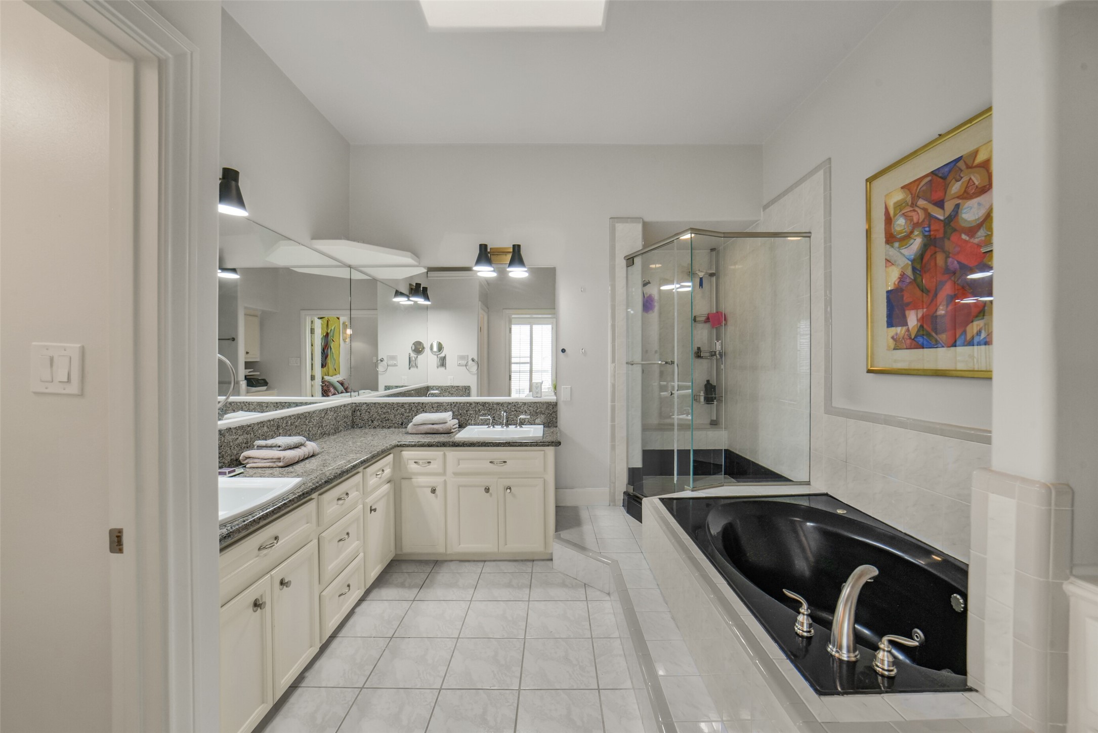 primary bathroom has walk in shower and separate tub