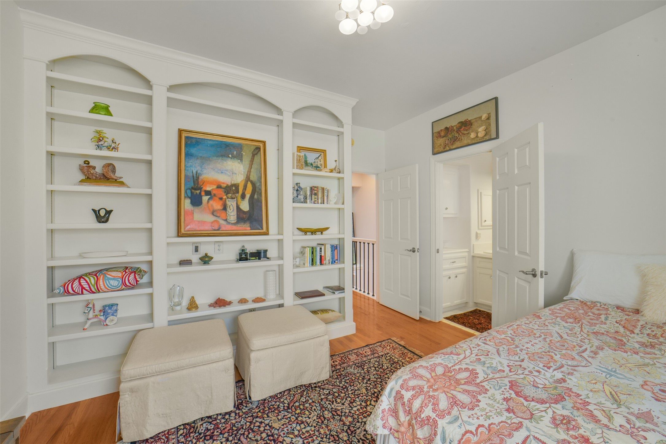 secondary bedroom has built in shelving and fits a queen bed