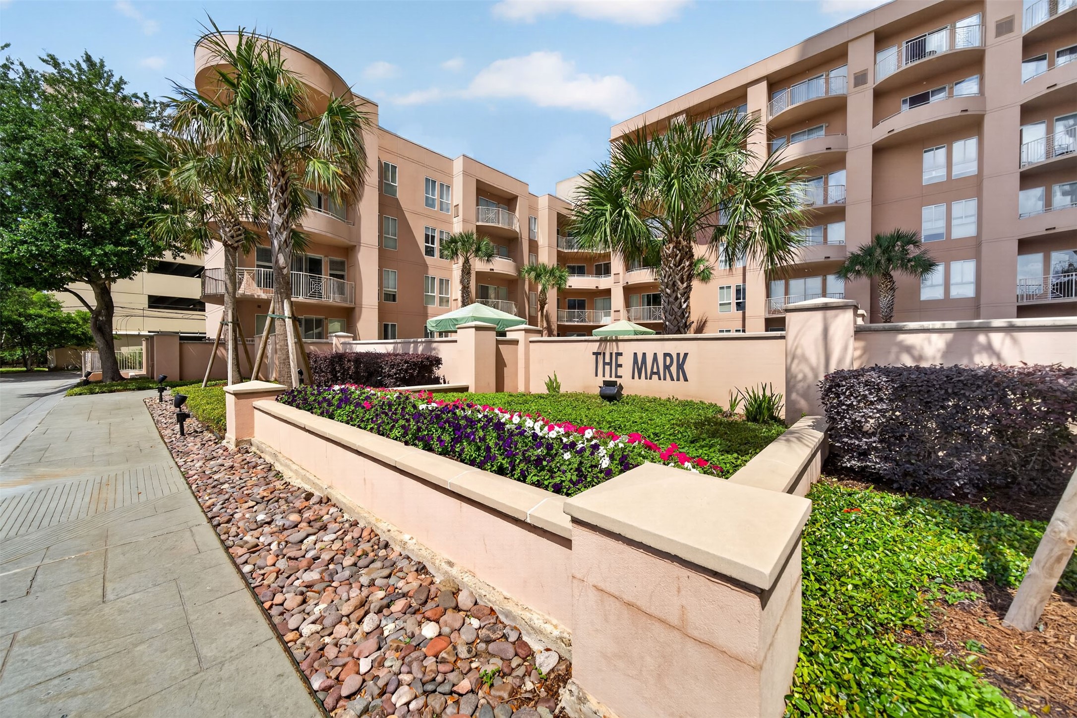 Modern condominium complex with 24 hour concierge, resort style pool and spa, fitness center, sauna, conference room and well-maintained landscaping, colorful flowerbeds, and inviting palm trees, offering a stylish and comfortable living environment. Modern condominium complex with 24 hour concierge, resort style pool and spa, fitness center, sauna, conference room and well-maintained landscaping, colorful flowerbeds, and inviting palm trees, offering a stylish and comfortable living environment.
