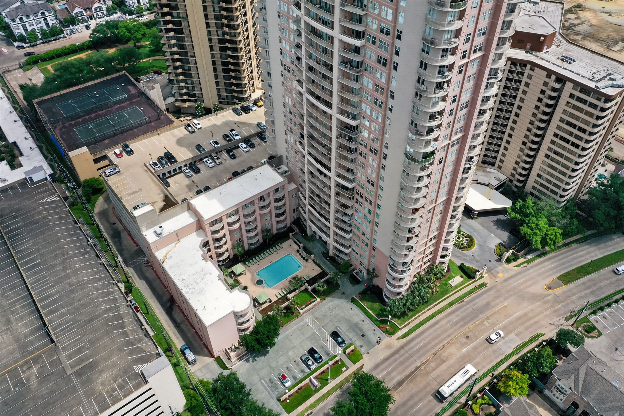 High-rise living at its finest, this condominium offers stunning views, a pristine swimming pool, and convenient access to tennis courts. Secure parking and lush landscaping enhance the urban lifestyle.