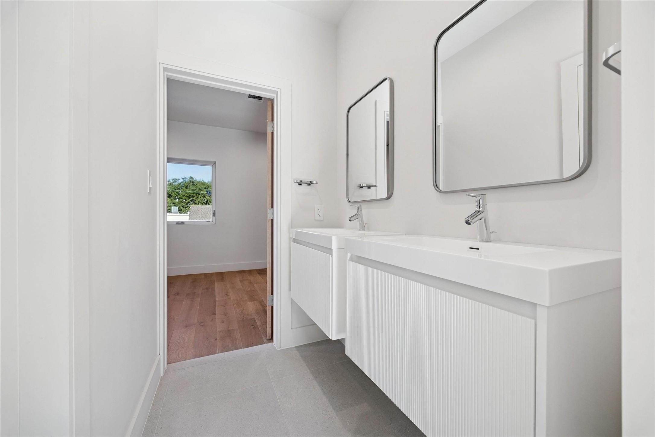 Secondary bathroom that conveniently connects the two secondary bedrooms.