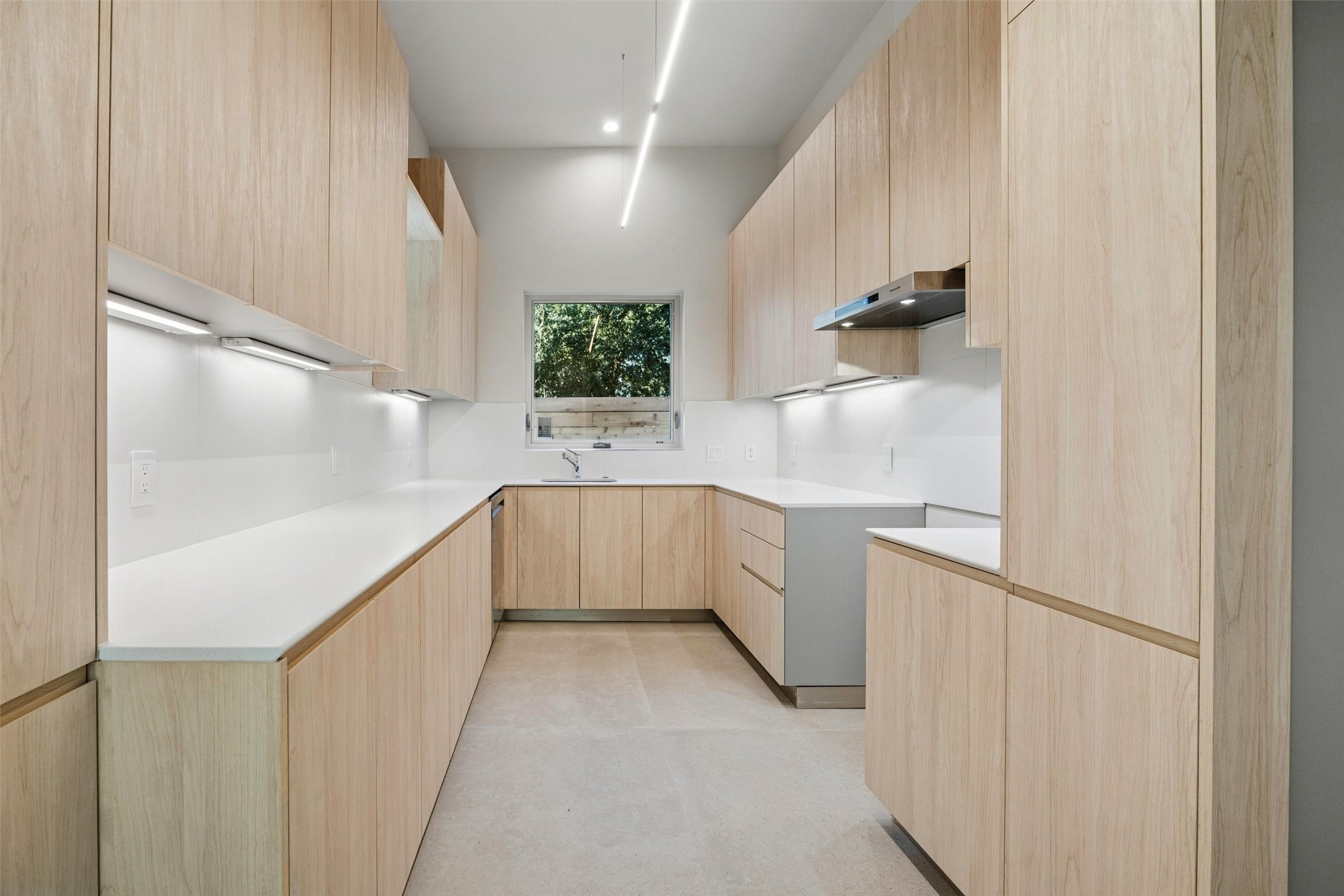 Stunning kitchen with custom cabinets and an abundance of counter space and storage.
