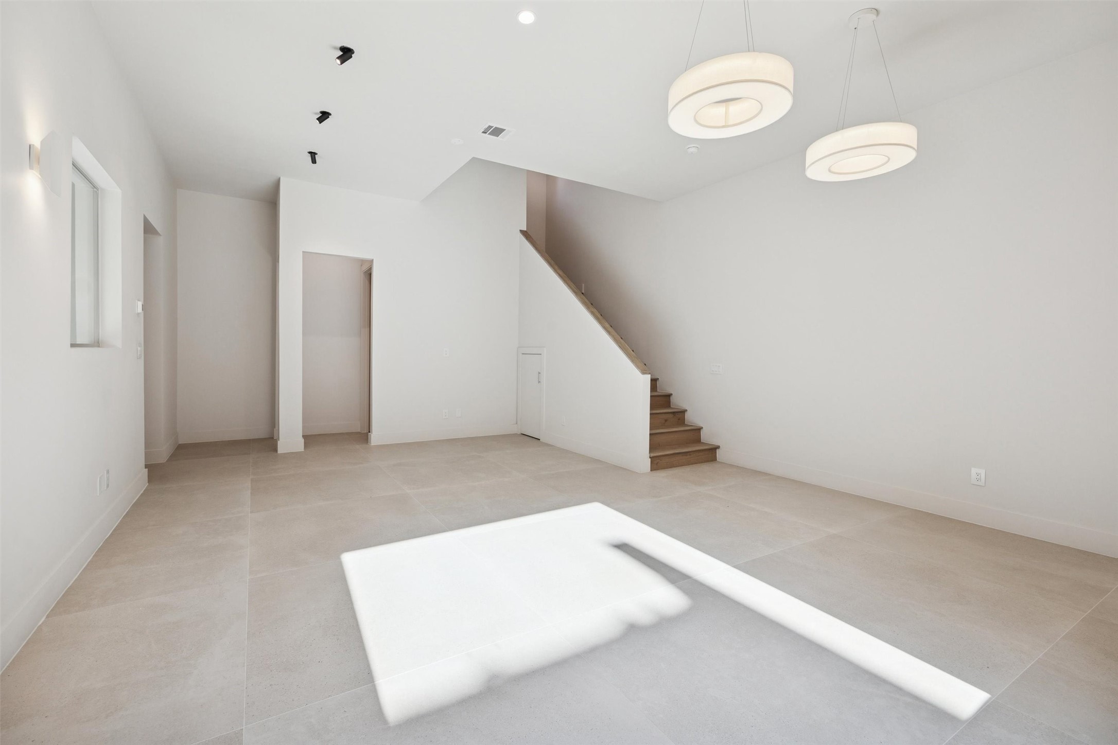 Enter the home into the 1st floor living room.