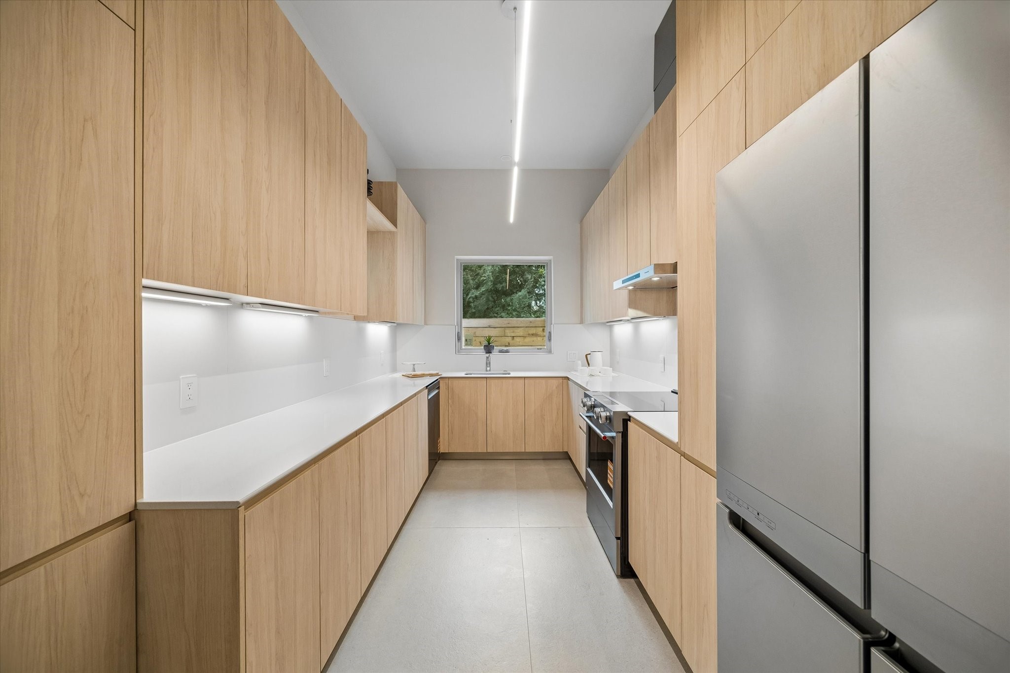 Stunning kitchen with custom cabinets and an abundance of counter space and storage.