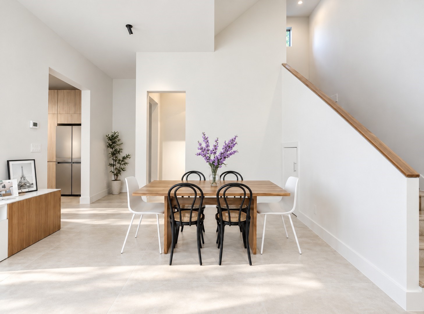 Staged dining room to show furniture configuration option.