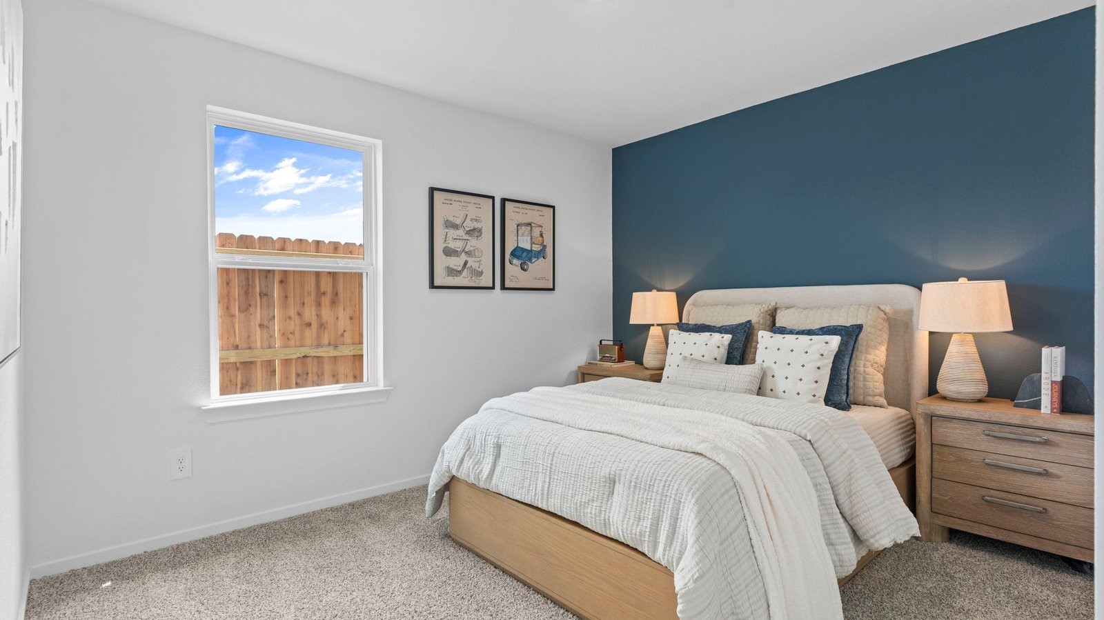 A second bedroom with carpet flooring and a separate closet