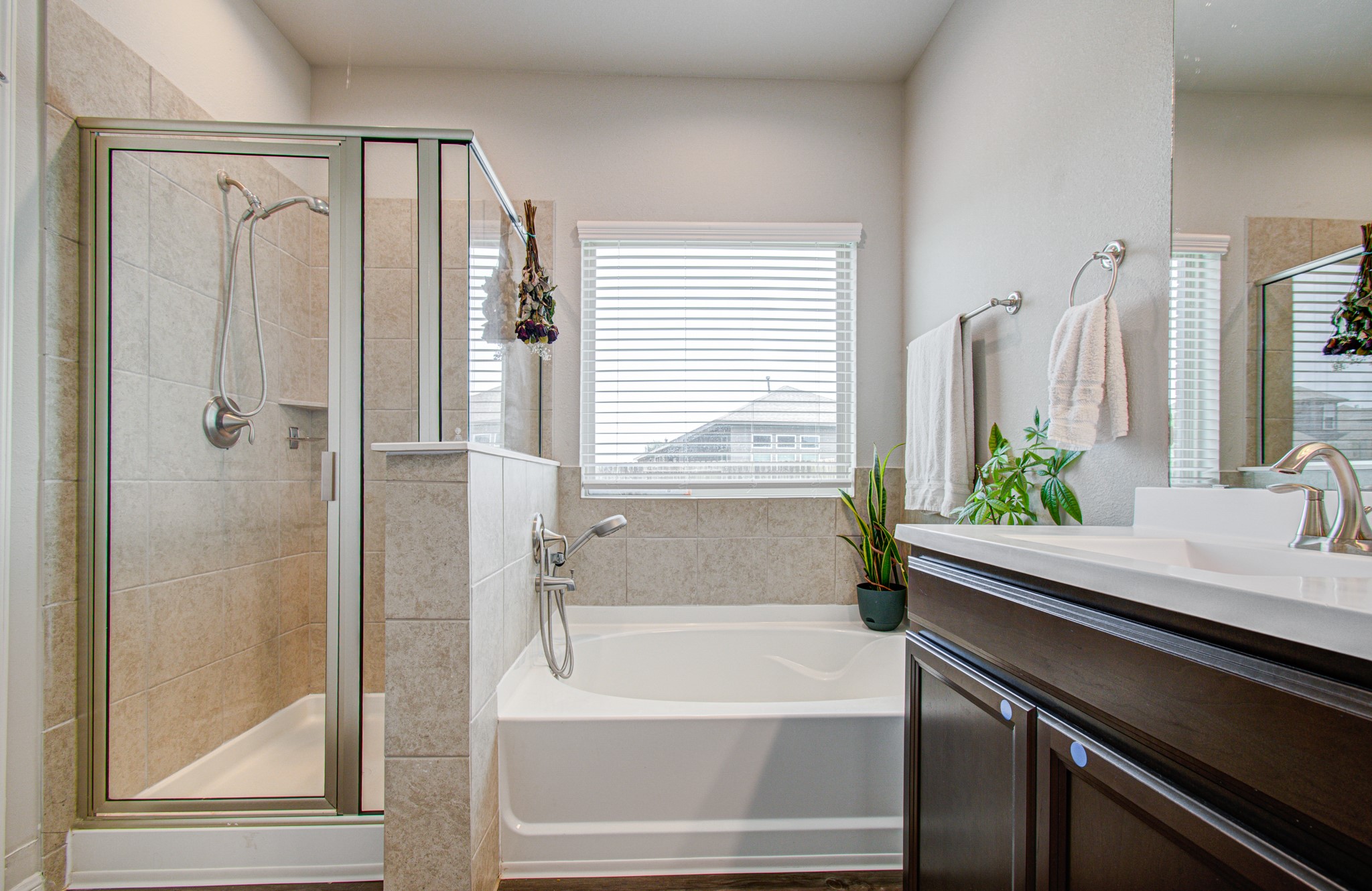 en-suite primary bathroom, with separate walk-in shower, oversized garden tub for relaxation, double-sink, and en-suite walk-in master closet.