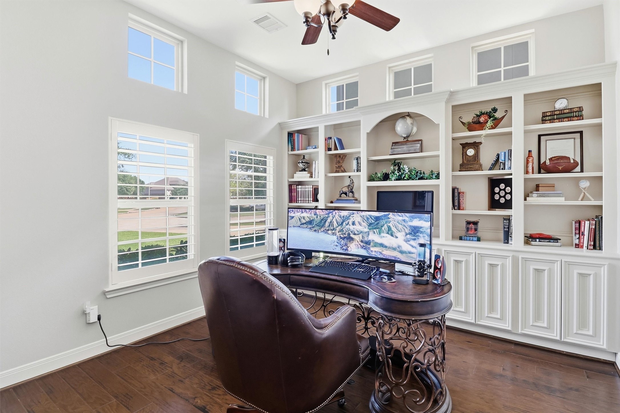 Work from home?  This is the perfect space - bright and cheerful, with a lovely built-in bookcase offering excellent storage.