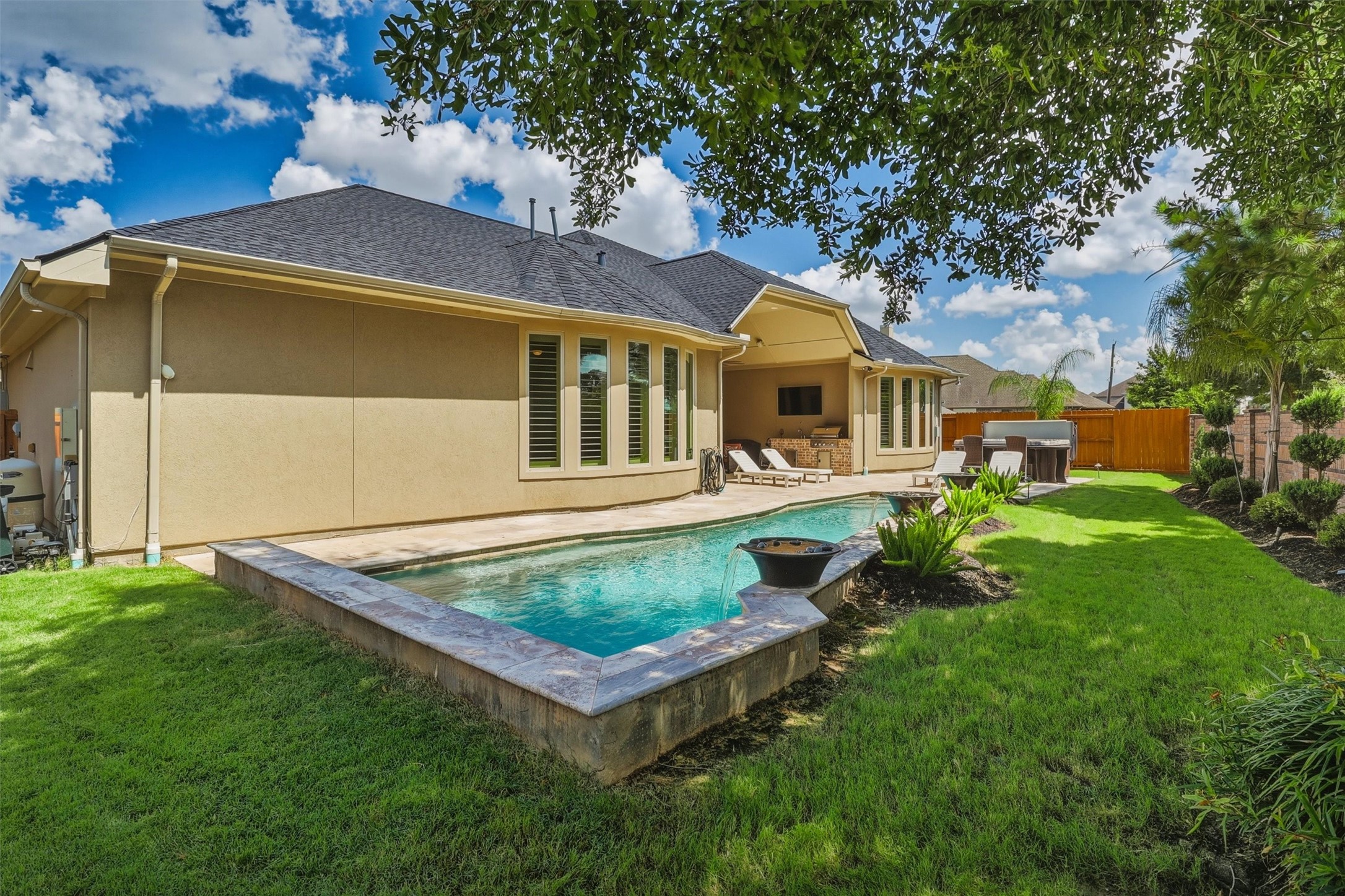 There is still green space behind the pool and on the side of the home in case you need more space for pets!