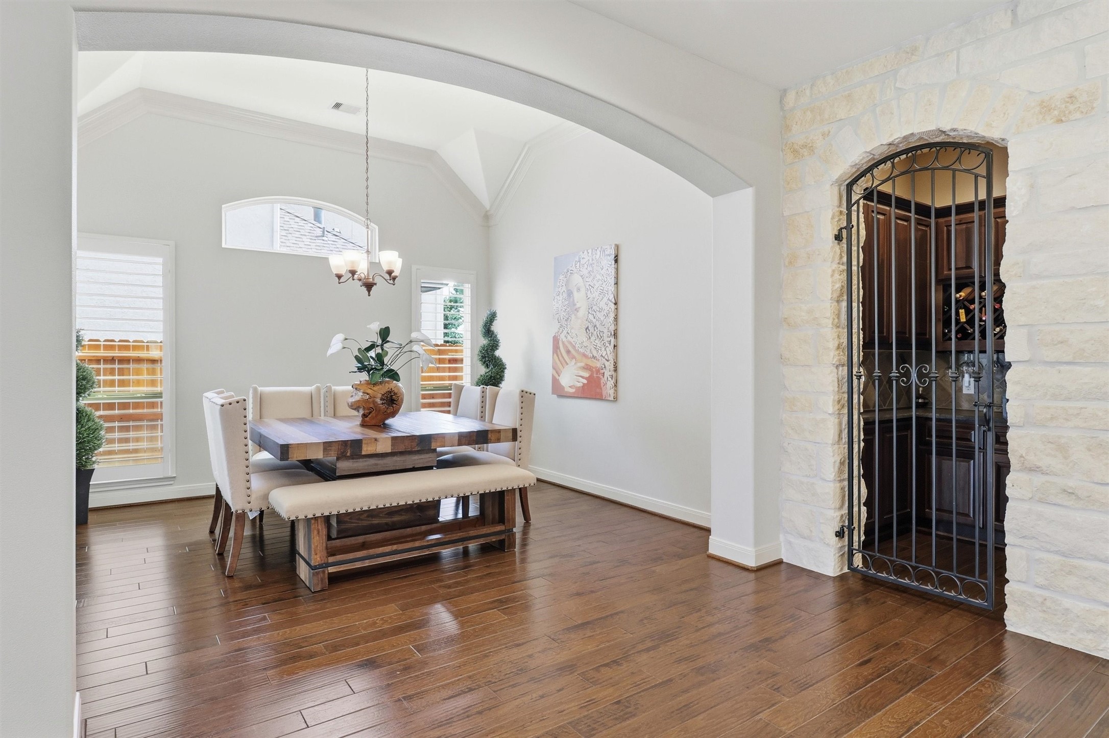 View of spacious dining room with wine grotto surrounded by gorgeous Austin chalk stone.