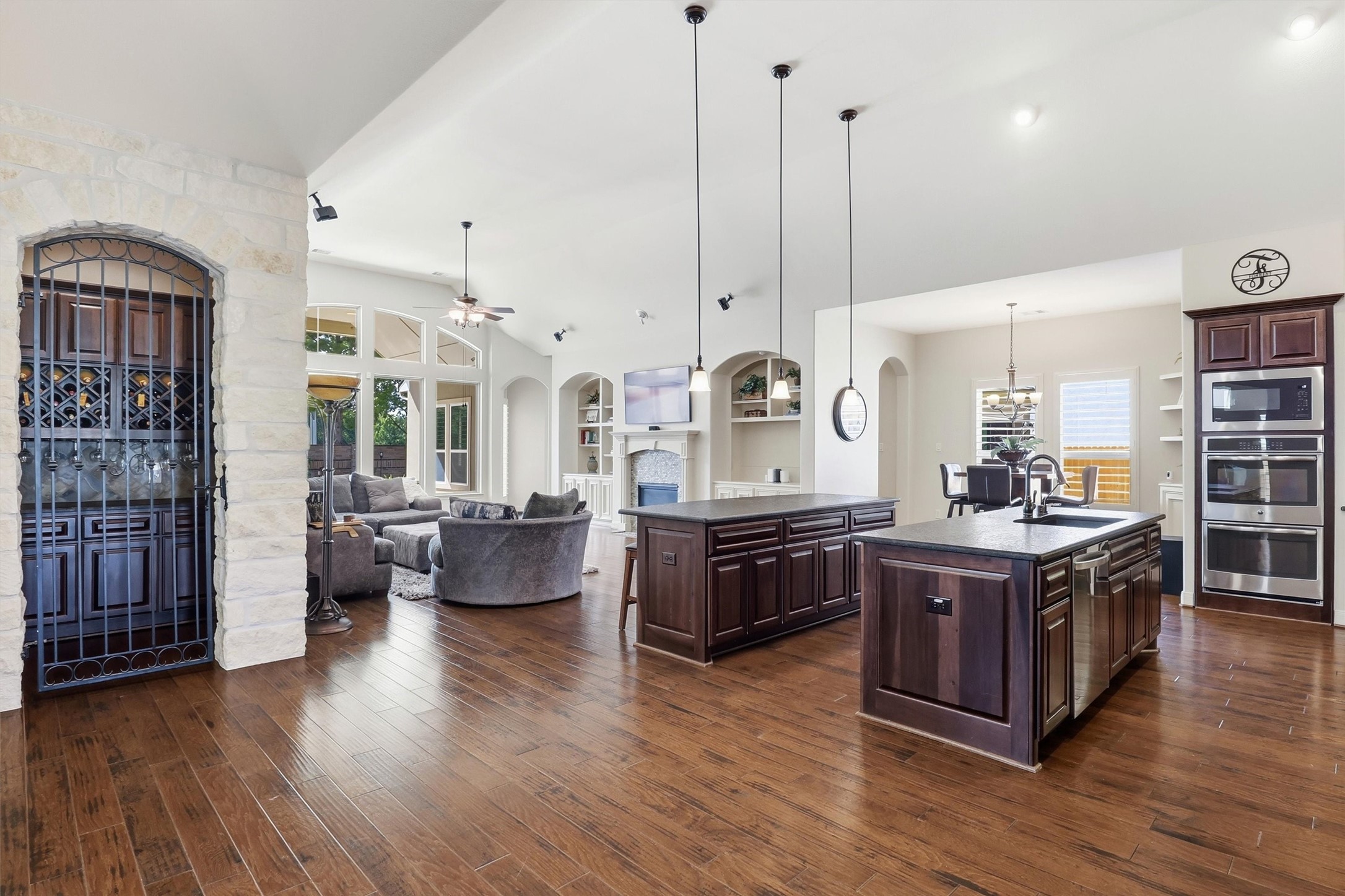 The ultimate open floorplan features a double-island kitchen and a wine grotto.  Entertaining just got easier!