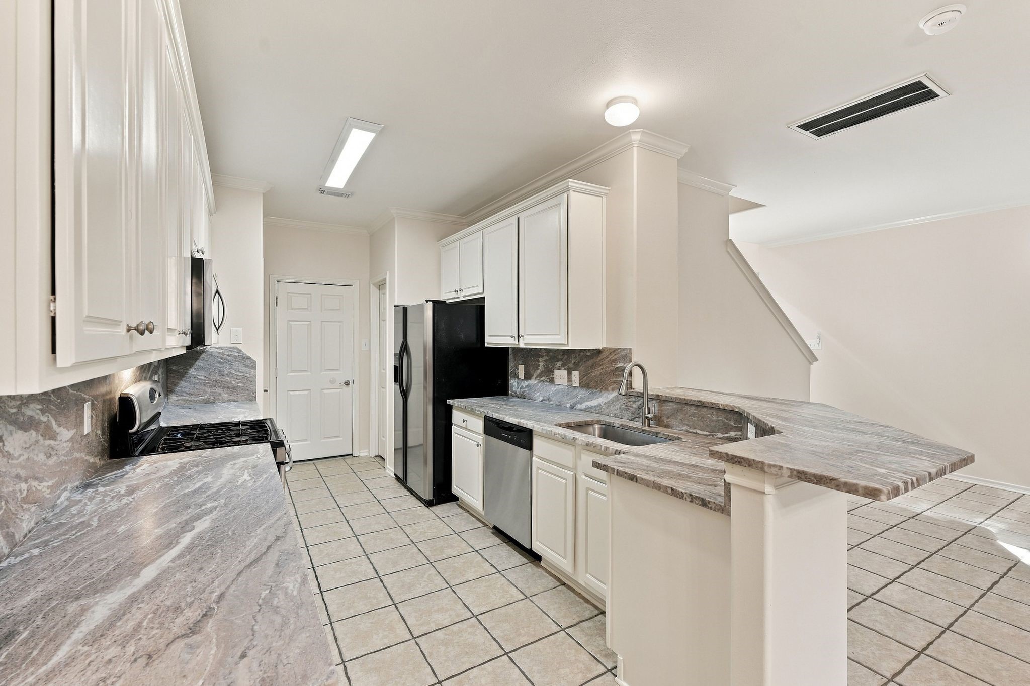 Be the first to enjoy these newly installed luxury granite counters, microwave, dishwasher and sink.   The cabinets have just been painted, and there are two large pantries that offer a significant amount of storage.