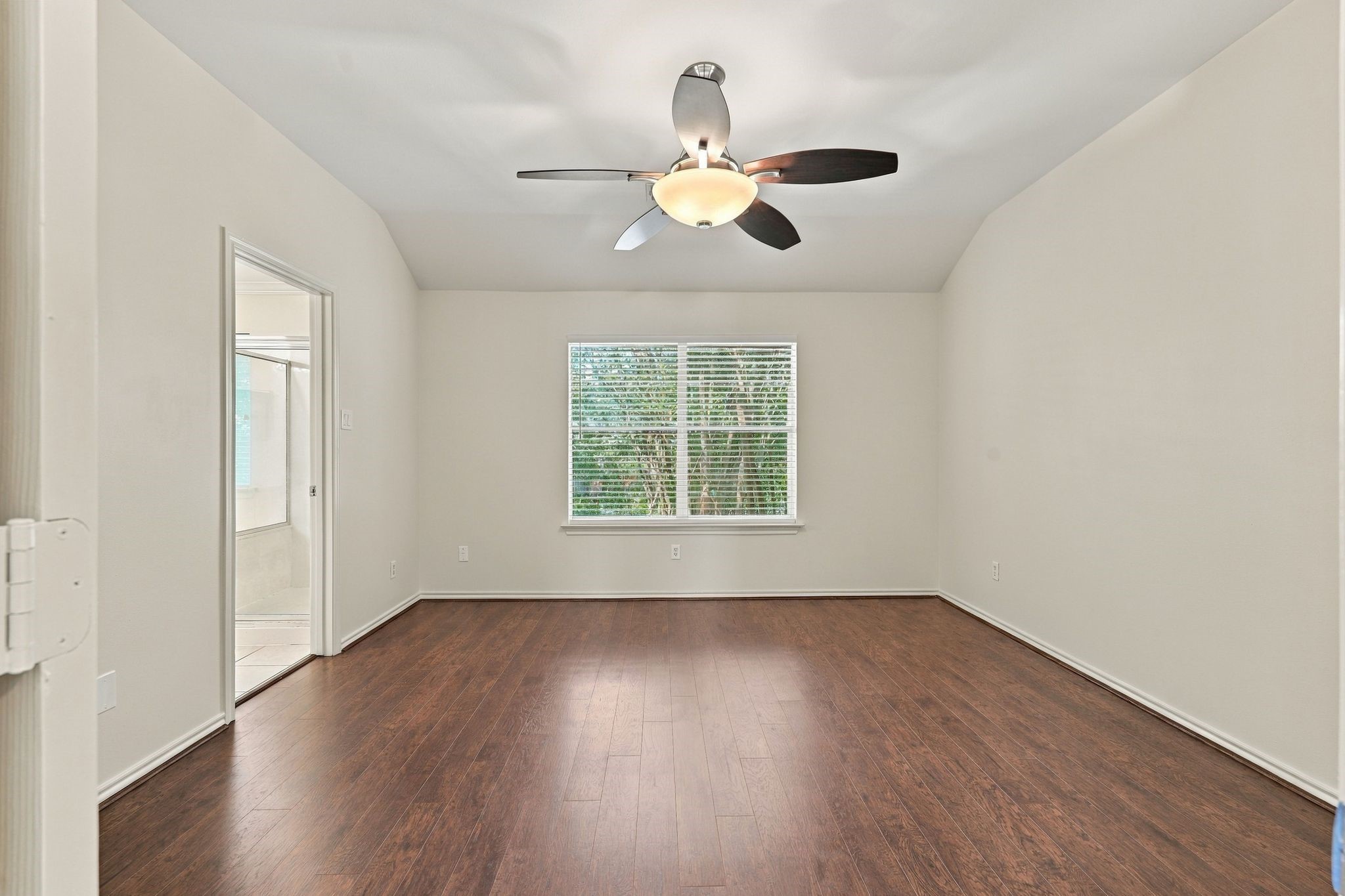 The main bedroom offers wood look flooring, new ceiling fan, freshly painted ceilings, walls and trim and a nice ensuite bathroom.
