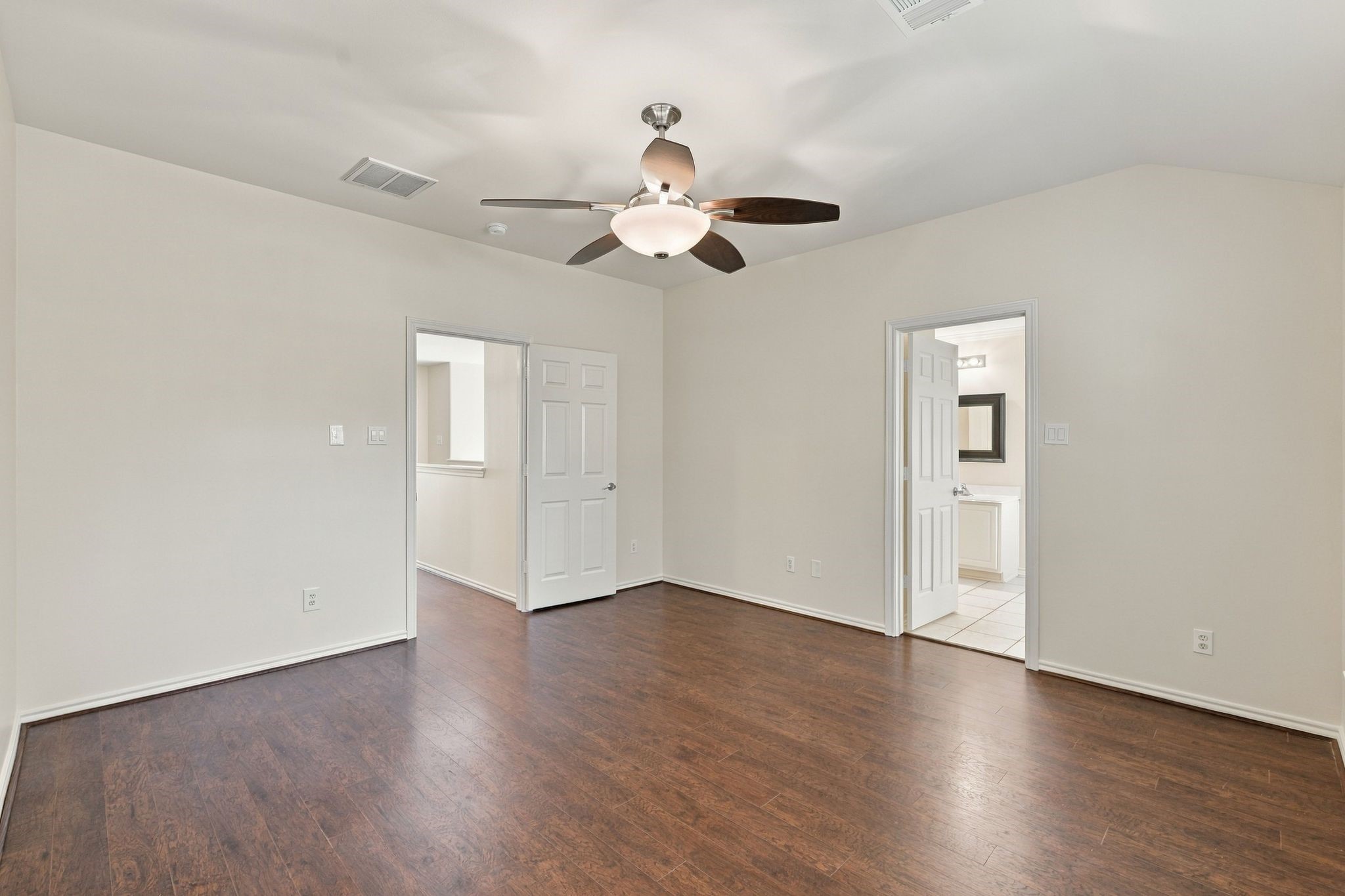 The main bedroom offers wood look flooring, new ceiling fan, freshly painted ceilings, walls and trim and a nice ensuite bathroom.
