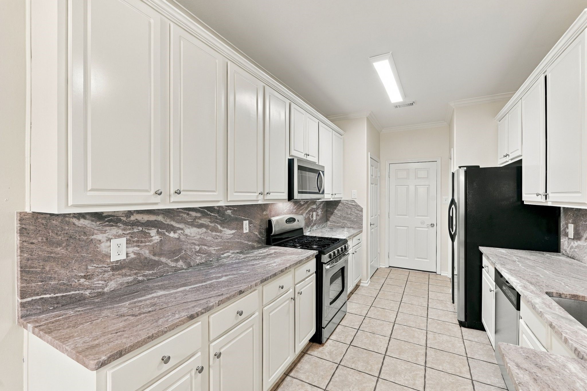 Be the first to enjoy these newly installed luxury granite counters, microwave, dishwasher and sink.   The cabinets have just been painted, and there are two large pantries that offer a significant amount of storage.