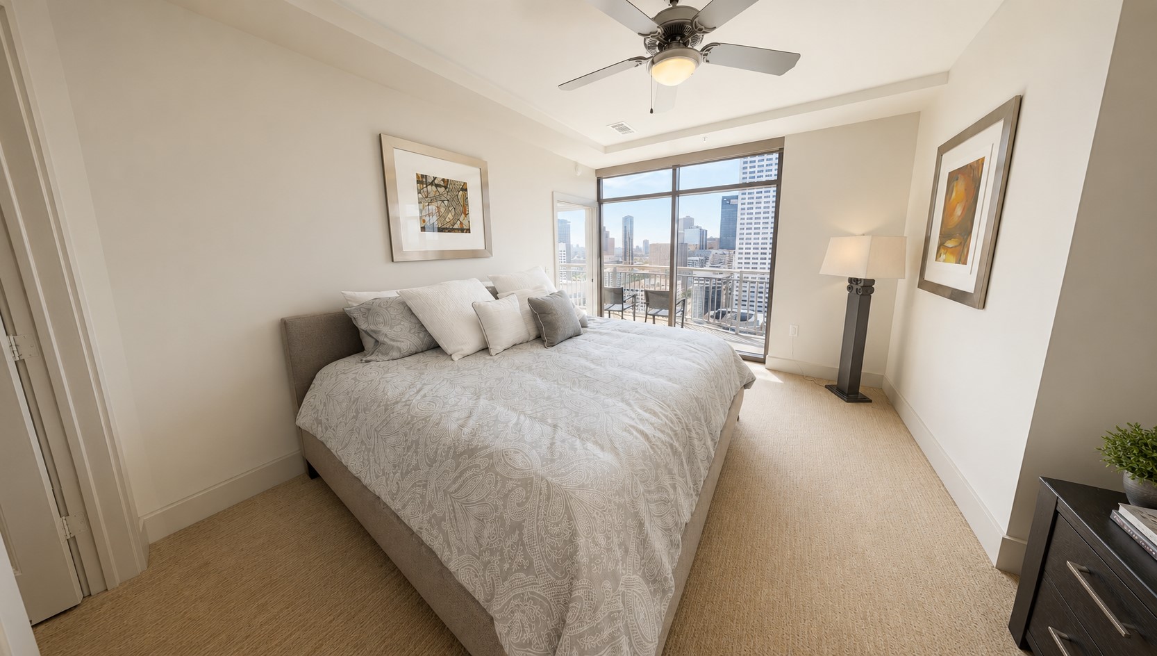 Imagine waking up with the city just outside your window. The primary bedroom enjoys beautiful natural light and direct access to the private balcony. Imagine waking up with the city just outside your window. The primary bedroom enjoys beautiful natural light and direct access to the private balcony.
