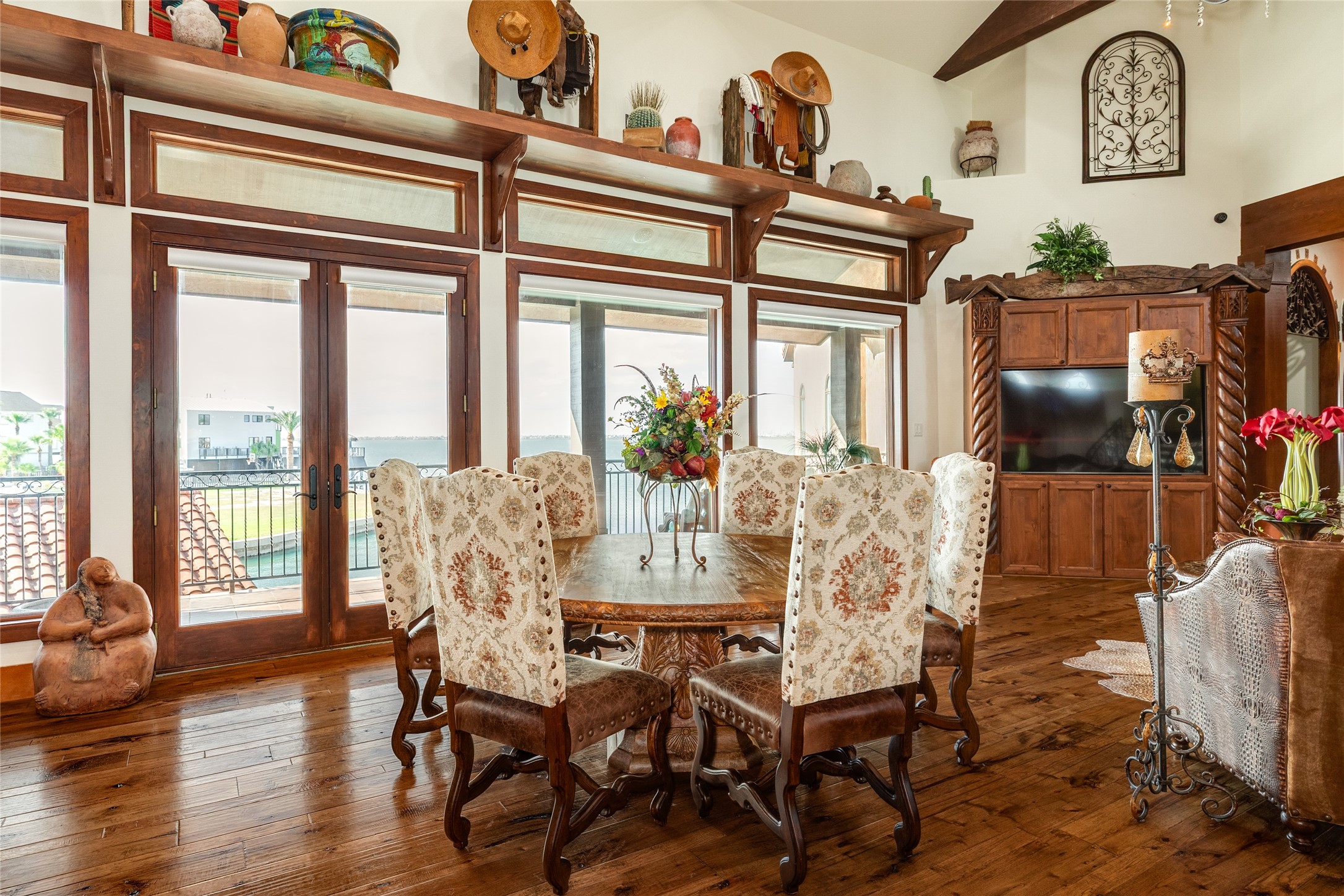 Dining area located between two seating areas, with views of the bay