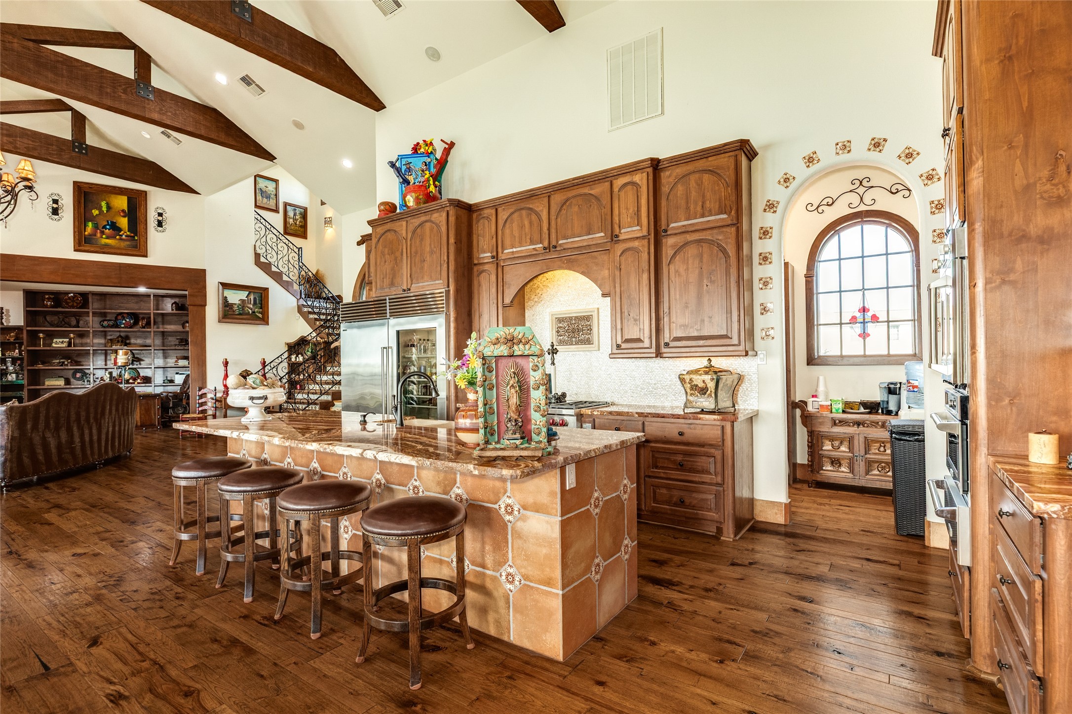 Bar seating at the kitchen, with walk-in butler's pantry