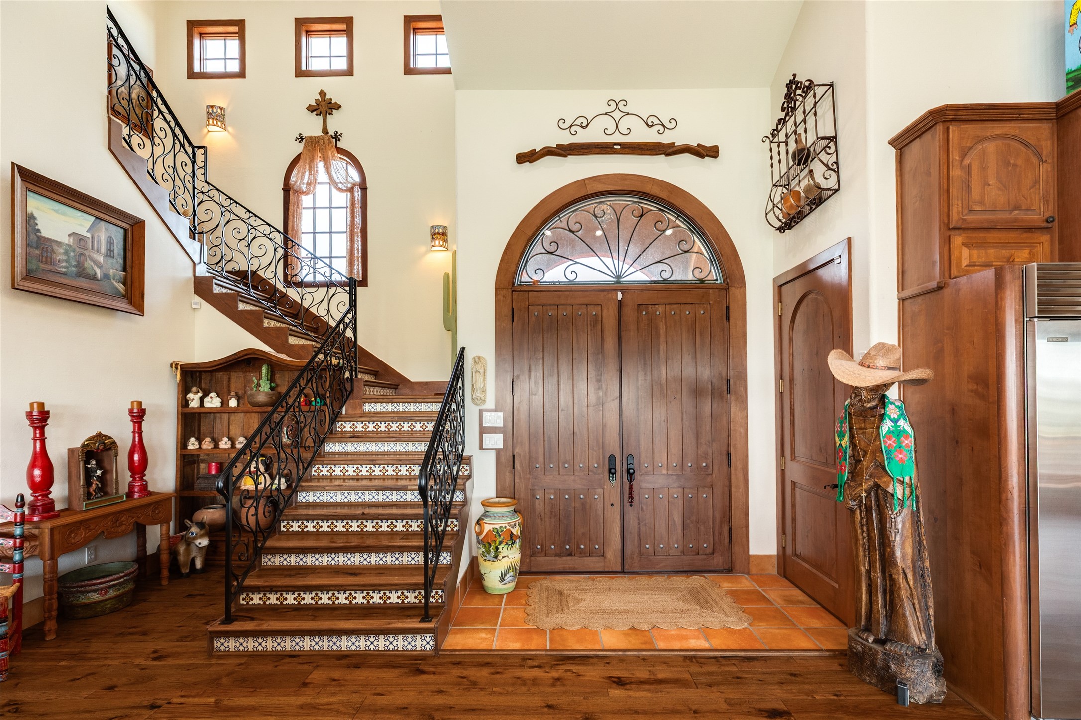 Front door and beautiful Spanish style steps with mexican tile inserts