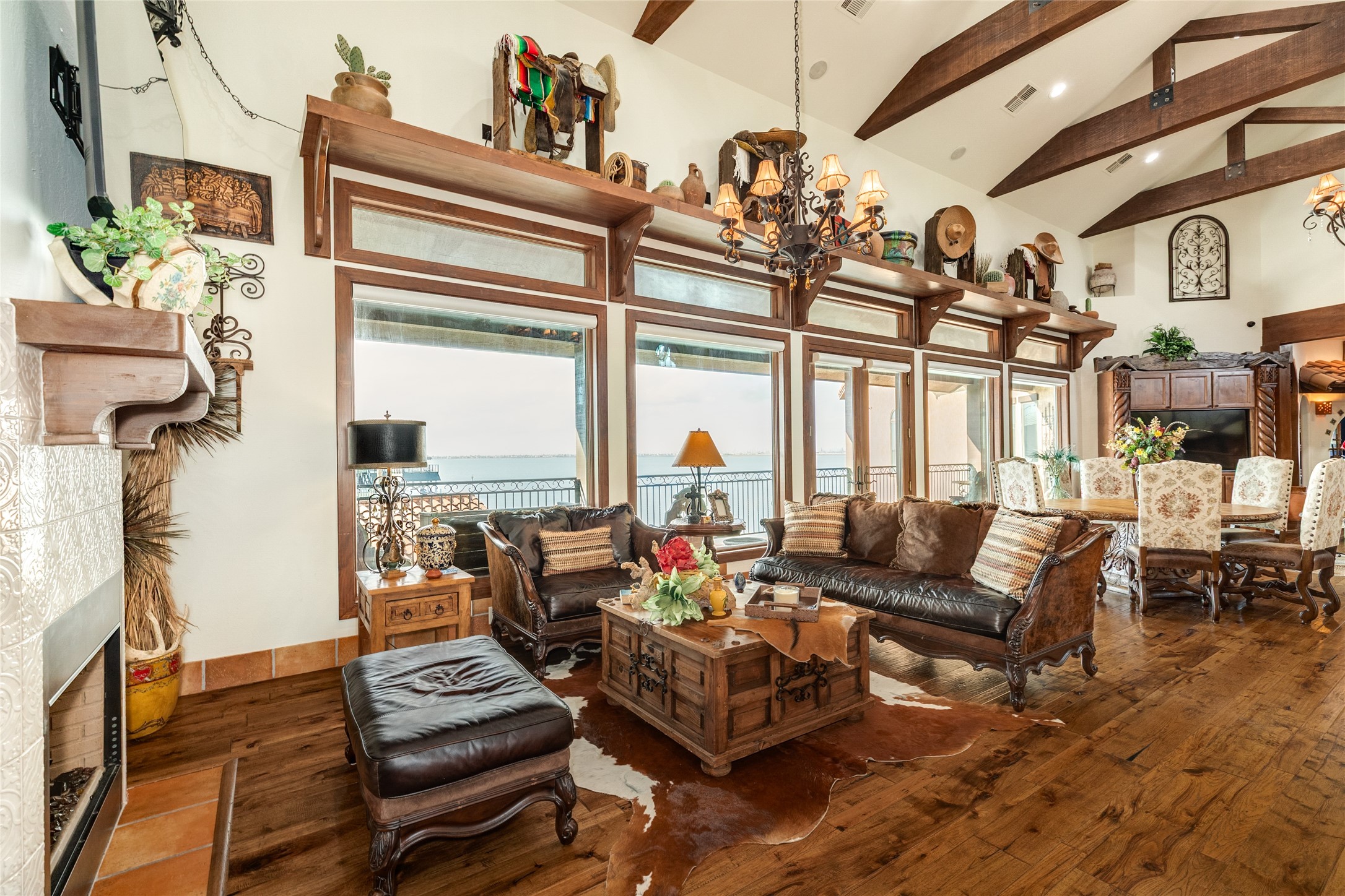 Fireplace with seating area at one end of the living room