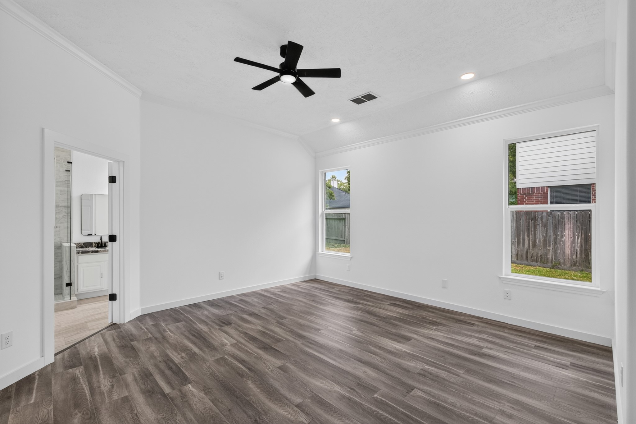 This bright and versatile room at 18 Griffin Hill Court is bathed in natural light from large windows and features a ceiling fan for year-round comfort. With generous proportions and pristine white walls, this space works beautifully as a bedroom, home office, playroom, or flex room  ready to suit any lifestyle need you envision.