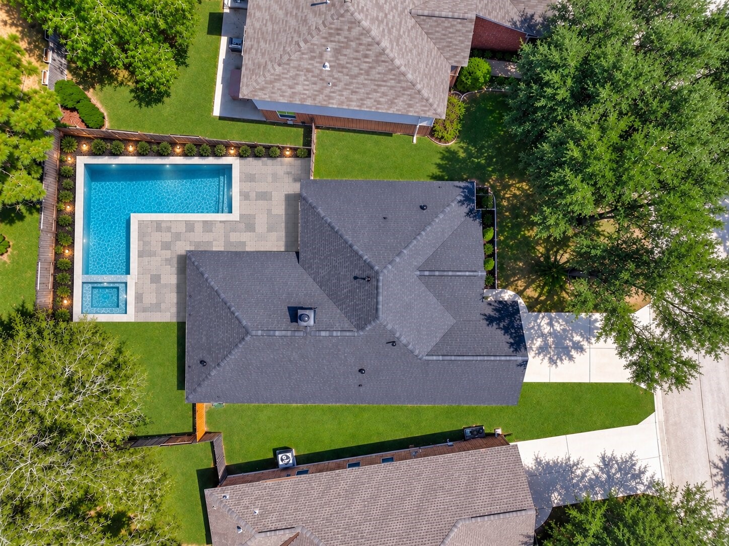 (VIRTUALLY Enhanced PHOTO) This rendering illustrates the breathtaking potential of 18 Griffin Hill Court's spacious backyard  imagine a resort-style in-ground pool paired with a beautifully paved patio designed for entertaining. The lot size and outdoor layout make this vision entirely achievable. Photo is an AI-generated rendering for illustrative purposes only and does not depict current property conditions.
