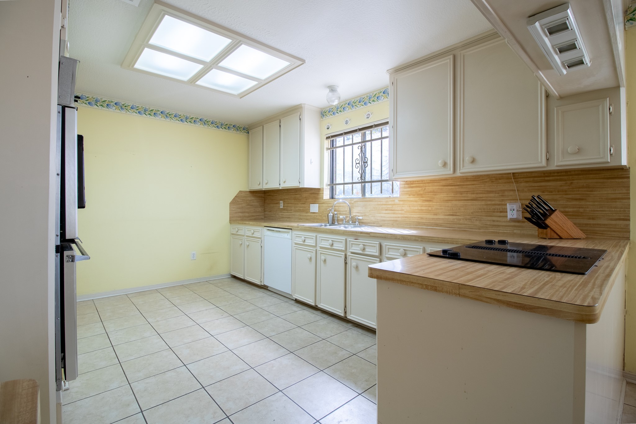 Skylights bring natural light into a kitchen ready for your vision, imagine the possibilities for its next chapter!