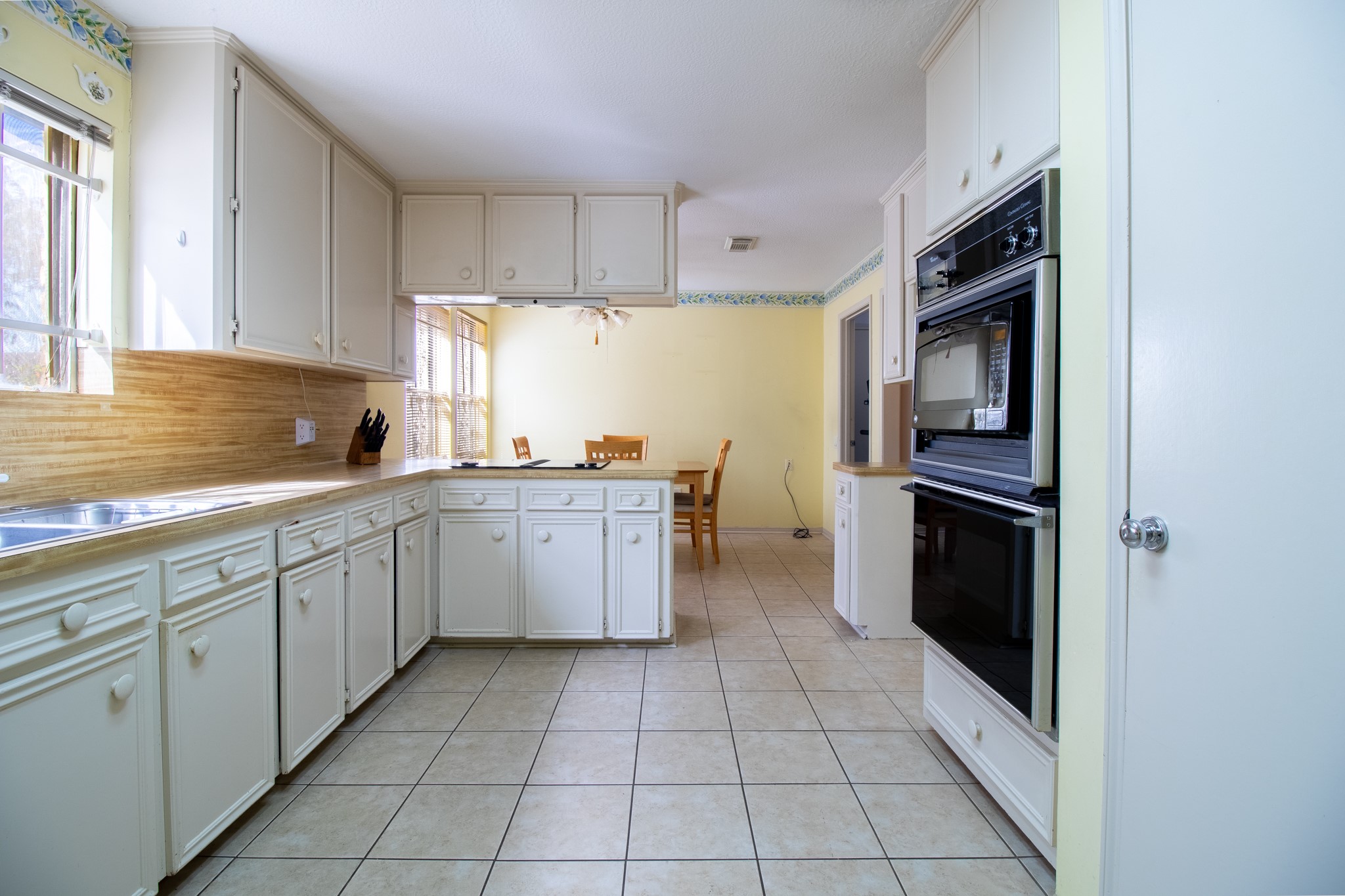 Imagine transforming this spacious kitchen into the heart of your home, where favorite meals and memories come together.