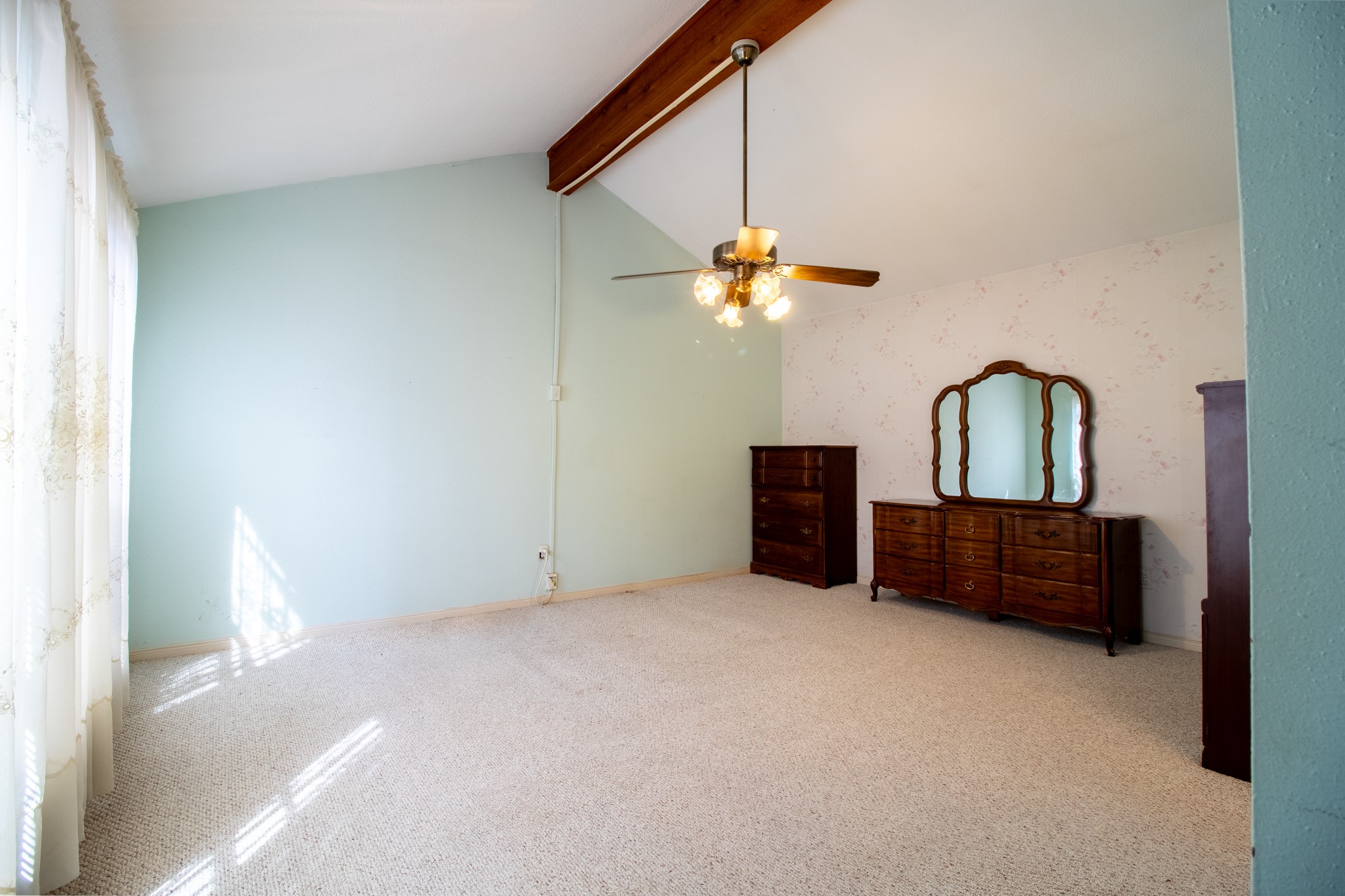 Your future personal sanctuary! Imagine creating a beautiful primary retreat beneath these dramatic vaulted ceilings.