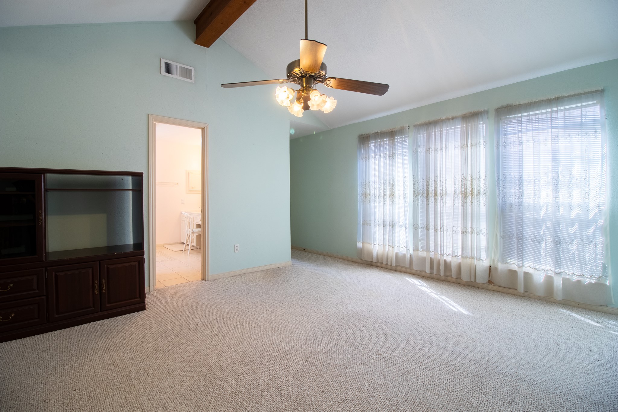 Imagine waking up to beautiful natural light streaming through the windows of your spacious primary bedroom, a peaceful retreat ready for your personal touch!
