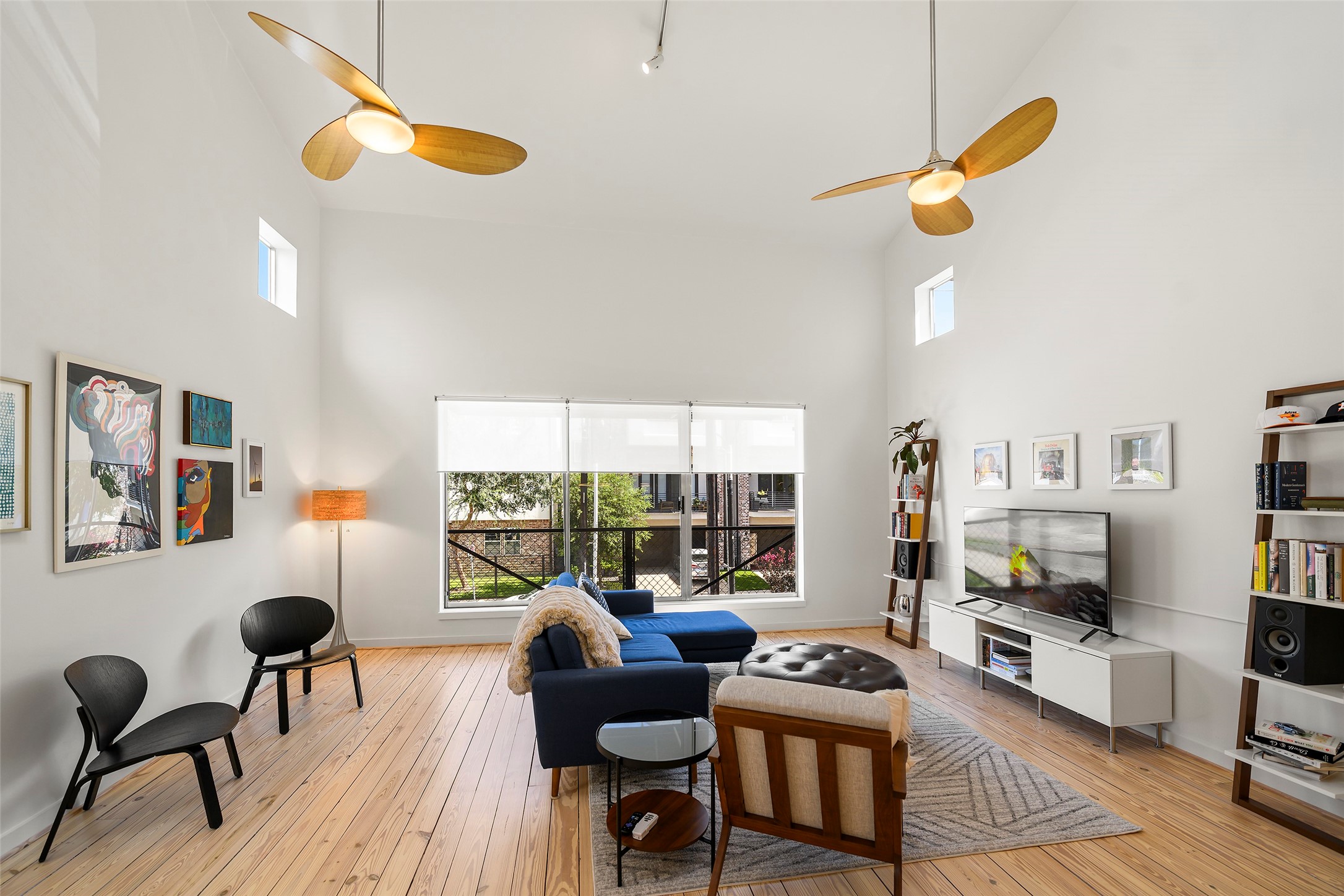 Living room has amazing view of the street. Blinds for privacy